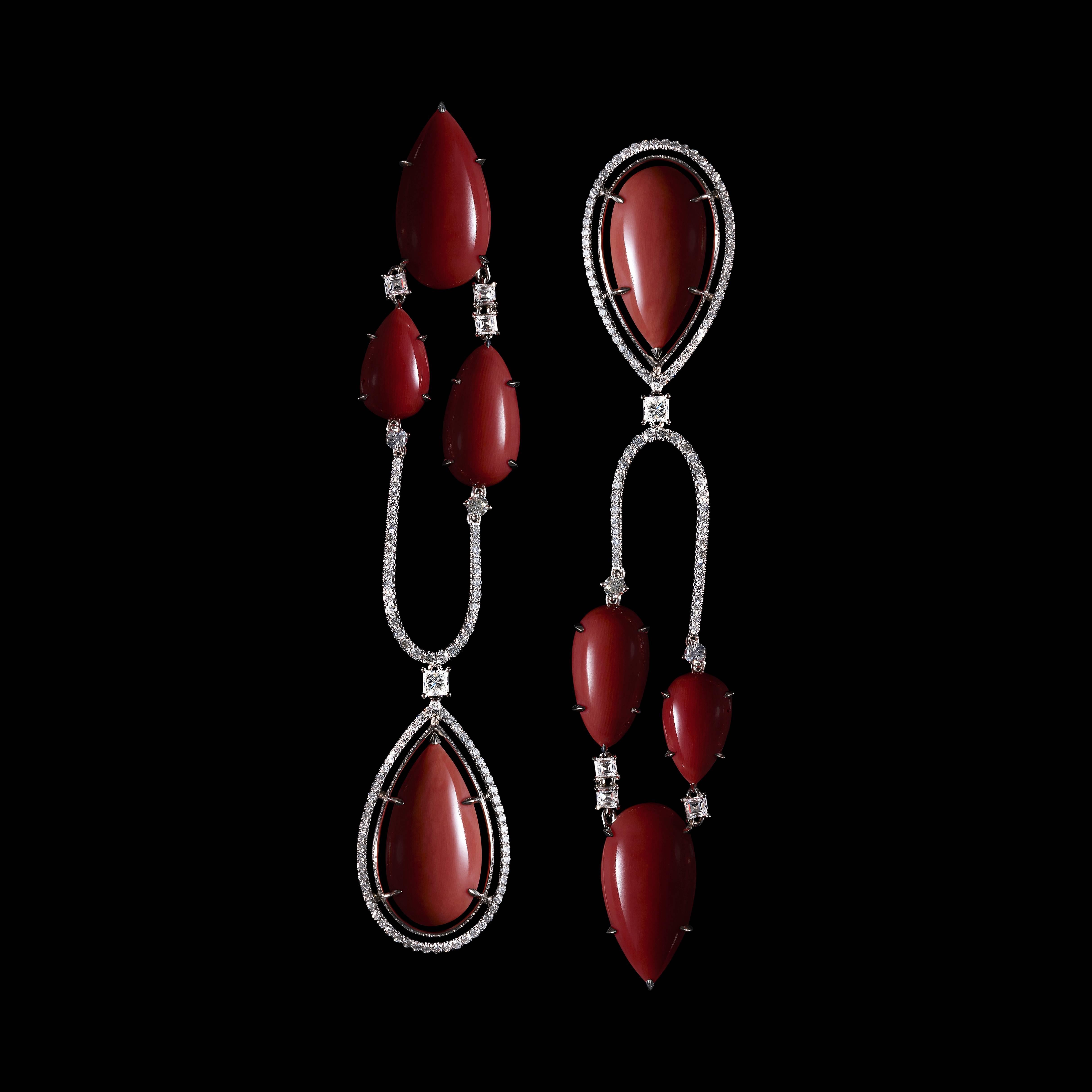 A limited-edition pair of Asymmetrical chandelier earrings features eight pear-shaped Corals and eight Fancy-shape Ideal-cut Diamonds. The Corals vary in color from precious deep red to pale pink, and are surrounded by Alexandra Mor's signature 1 mm