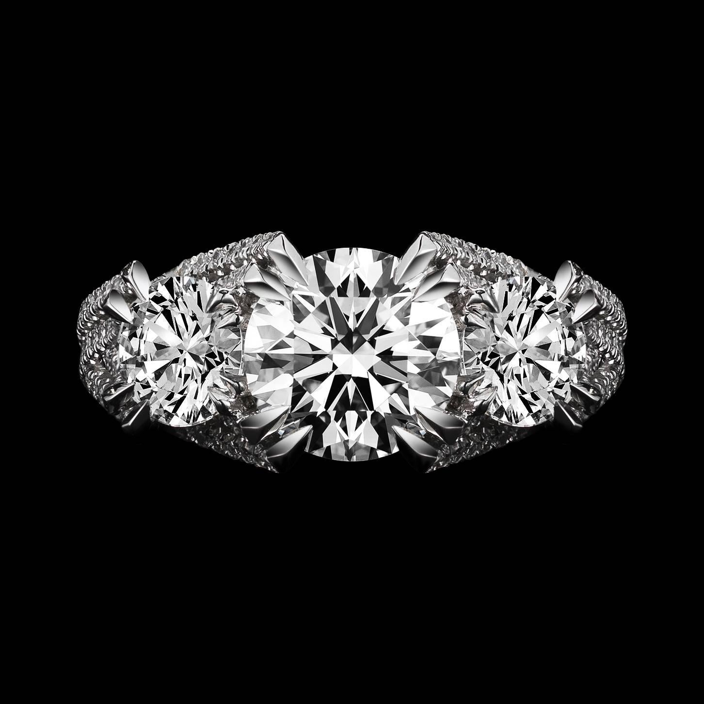 *This design is available with center diamonds weighing from 1ct - 10 cts and larger.  Please contact us for more information on this piece or on creating your own custom Alexandra Mor Design.  

This Alexandra Mor original three-stone woven ring