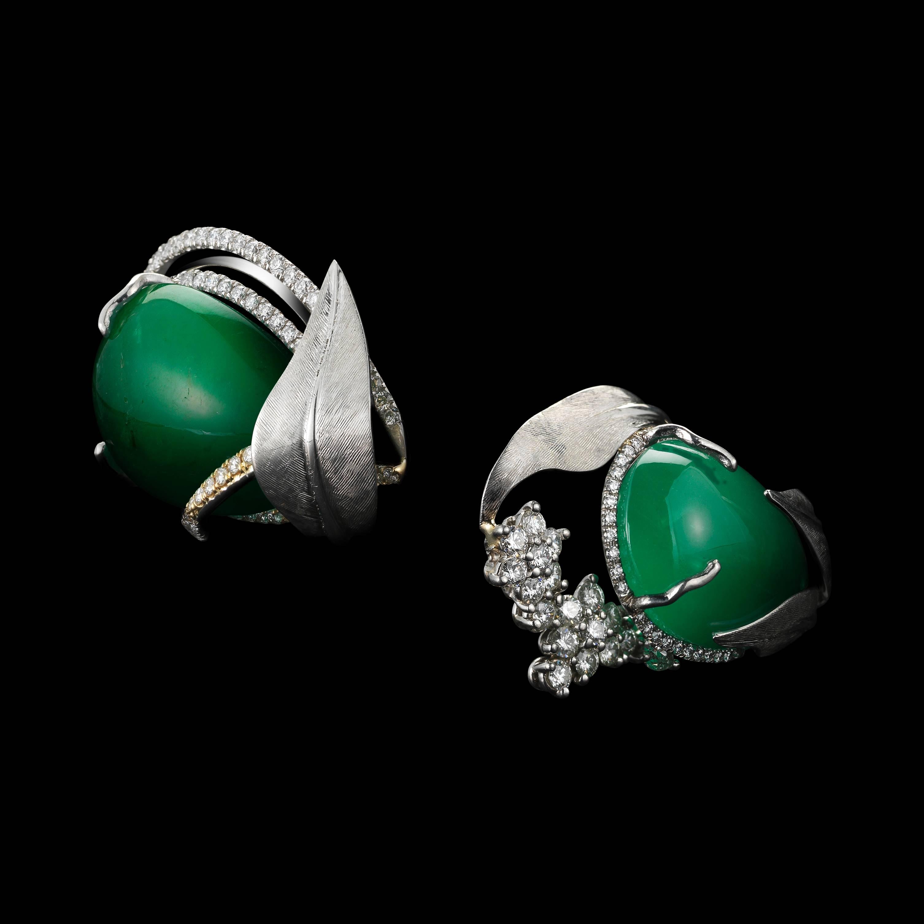 Dramatic, one-of-a-kind Alexandra Mor cuff earrings featuring matching Drop-shaped natural green Emeralds weighing 52.58 Cts. , encircled by Alexandra Mor's signature details of 1mm floating Diamond melee , and knife-edged wire. Earrings are further