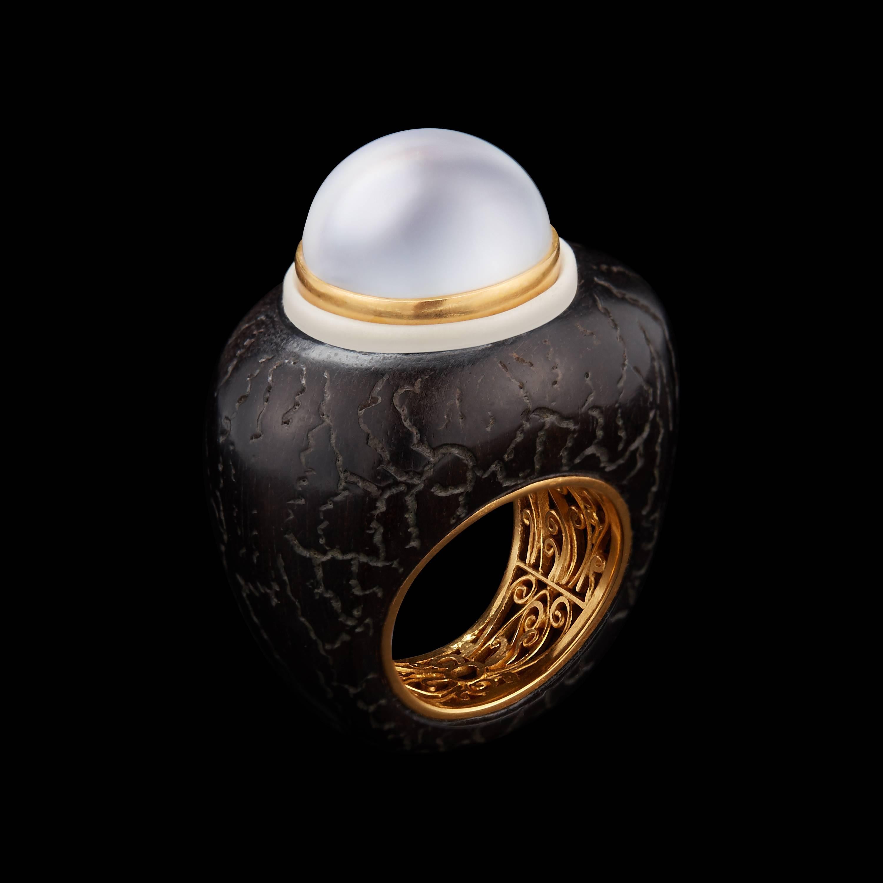 *Please contact us for more information on this piece or on creating your own Alexandra Mor custom Design. 

This Alexandra Mor ring features a 16.74mm white Baroque South Sea Pearl set in a 22 karat gold bezel accented with a carved, wild-harvested