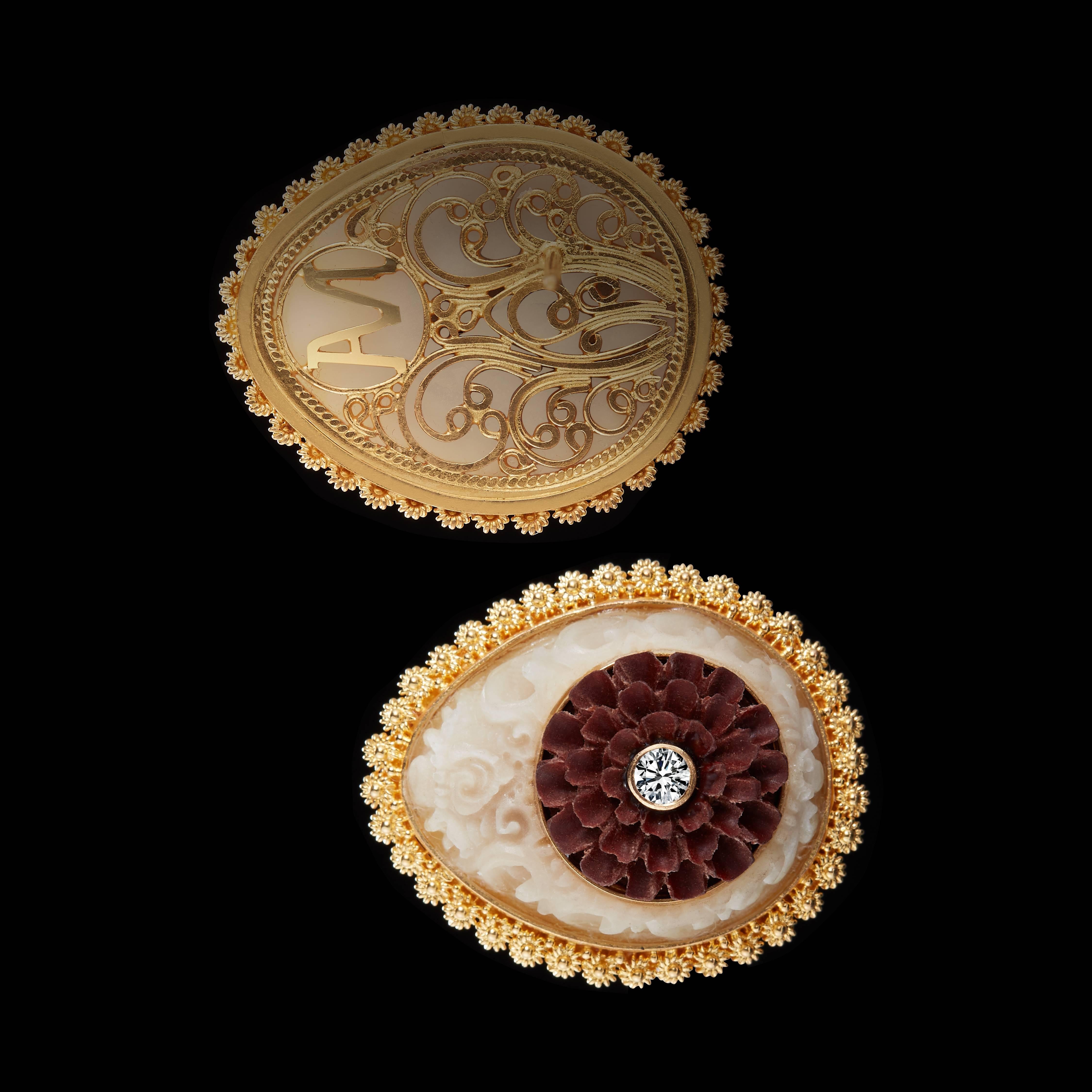 These teardrop-shaped stud earrings feature 13mm carved Sawo wood Lotus flowers accented by two Brilliant-cut Diamonds weighing .22 carats total, and are surrounded by the Balinese Kayonan, or Tree of Life motif in 17mm wild-harvested carved Tagua.