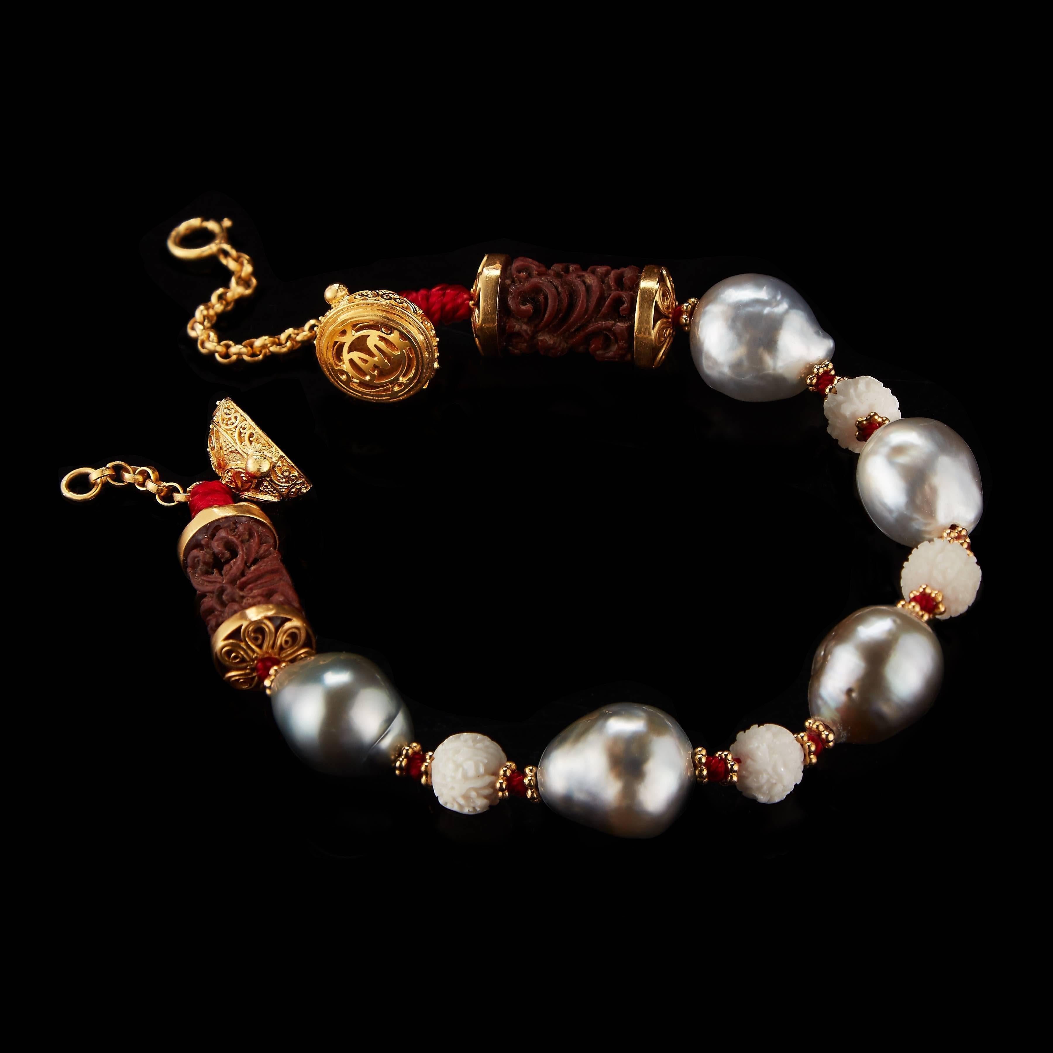 *Please contact us for more information on this piece or on creating your own Alexandra Mor custom Design. 

This Tibetan inspired Alexandra Mor bracelet features 11mm beads made from carved wild-harvested Tagua, Sawo wood, Baroque South Sea pearls