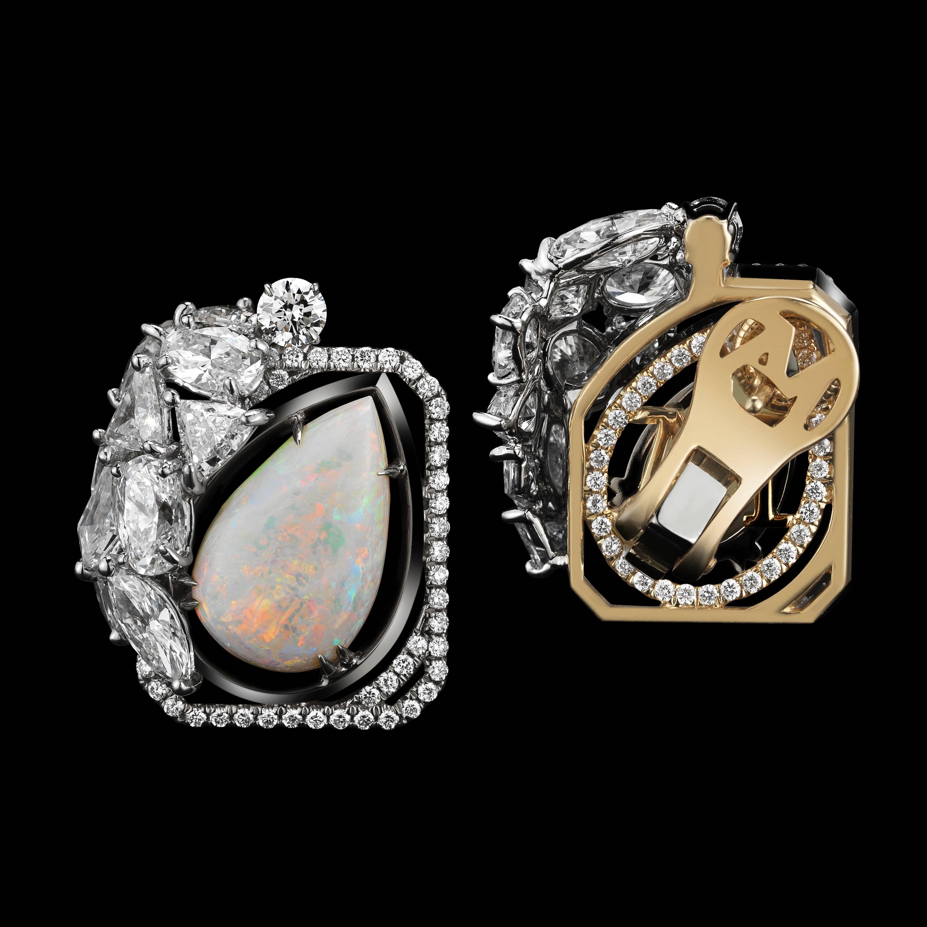 A pair of pear-shape Opal earrings featuring Round, Marquise, Trilliant, and Oval-shape Diamonds detailed with Alexandra Mor's signature floating Diamond melee and knife-edged wire. Earrings are set in 18 karat white gold on 18 karat yellow gold