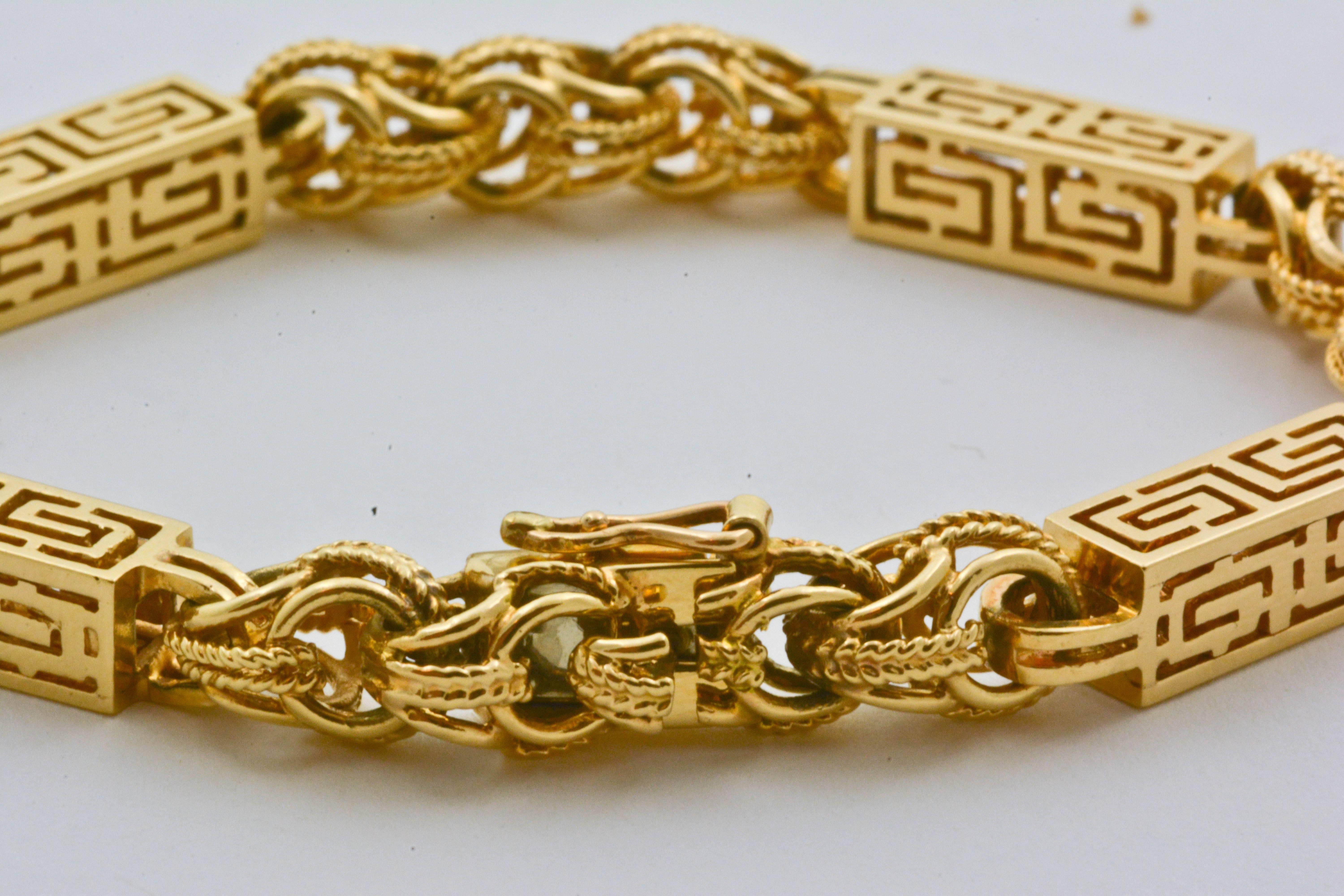 A repeating Greek key design makes this fashionable gold bracelet unique. Featuring rope-textured links and stunning artistry, this bracelet measures 8in long and 4mm thick, making it the perfect size for comfort and style.