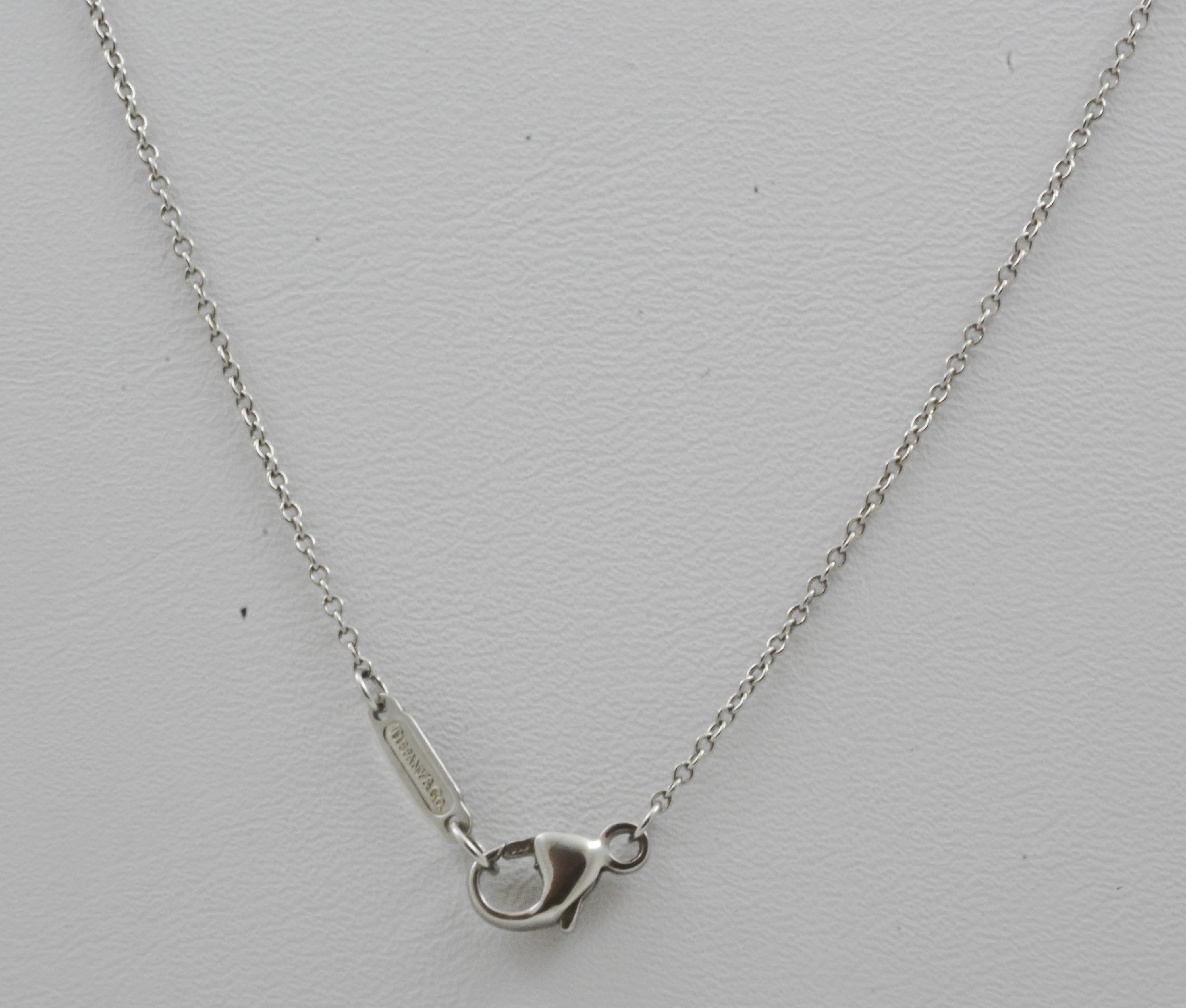 Displayed on a lovely, 16in platinum cable chain, this classic Tiffany & Co. tapered diamond Jazz pendant set is sure to add sparkle to your life. Six round, brilliant cut diamonds with an approximate total weight of 0.50 carats (clarity VS,