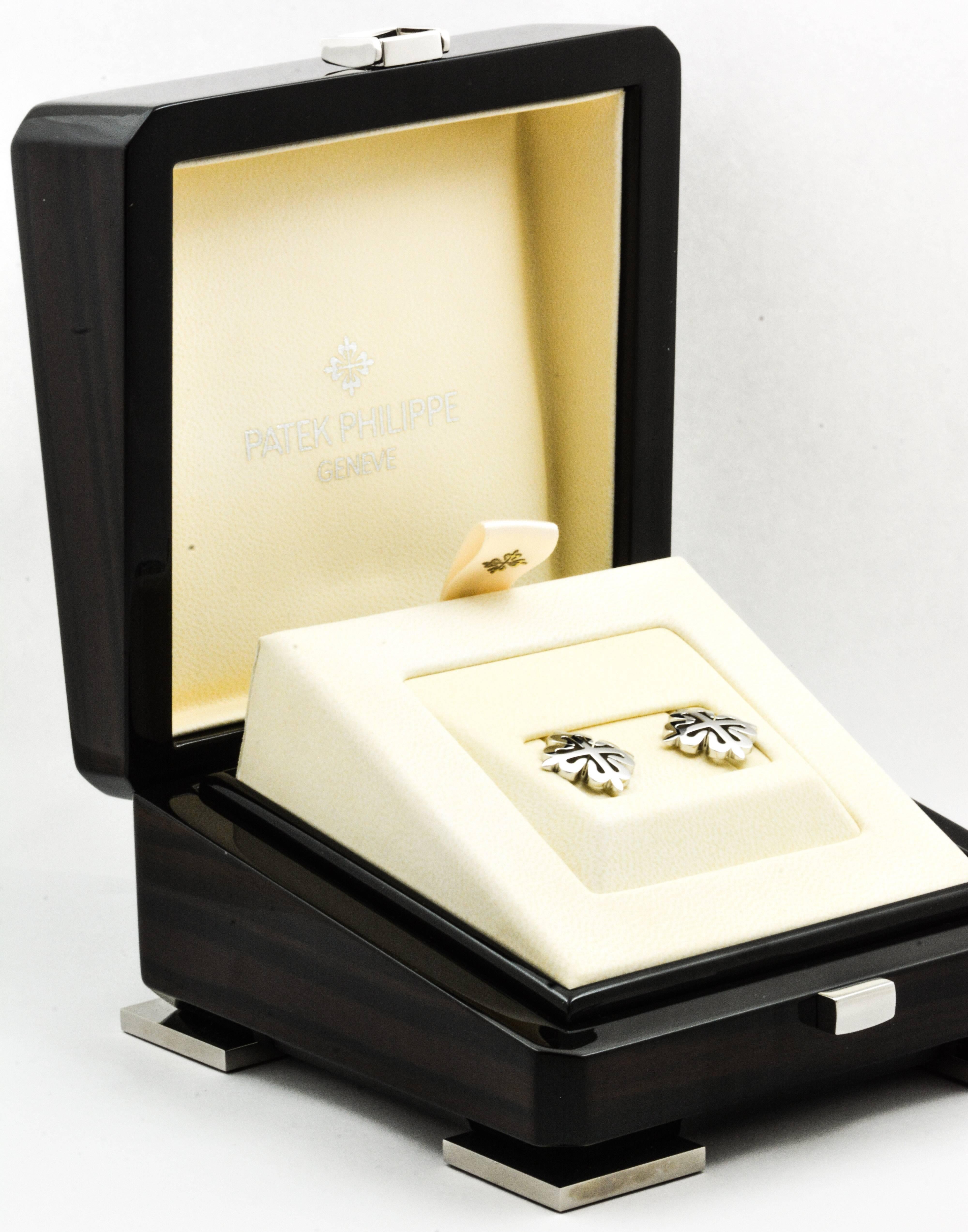 These classic Patek Philippe Calatrava Cross cuff links are fashioned in an 18kt white gold mirror finished high polish.  These Patek Philippe cufflinks measure 19.36X19.36mm  and are fitted with extremely high quality backs.  These Calatrava Cross