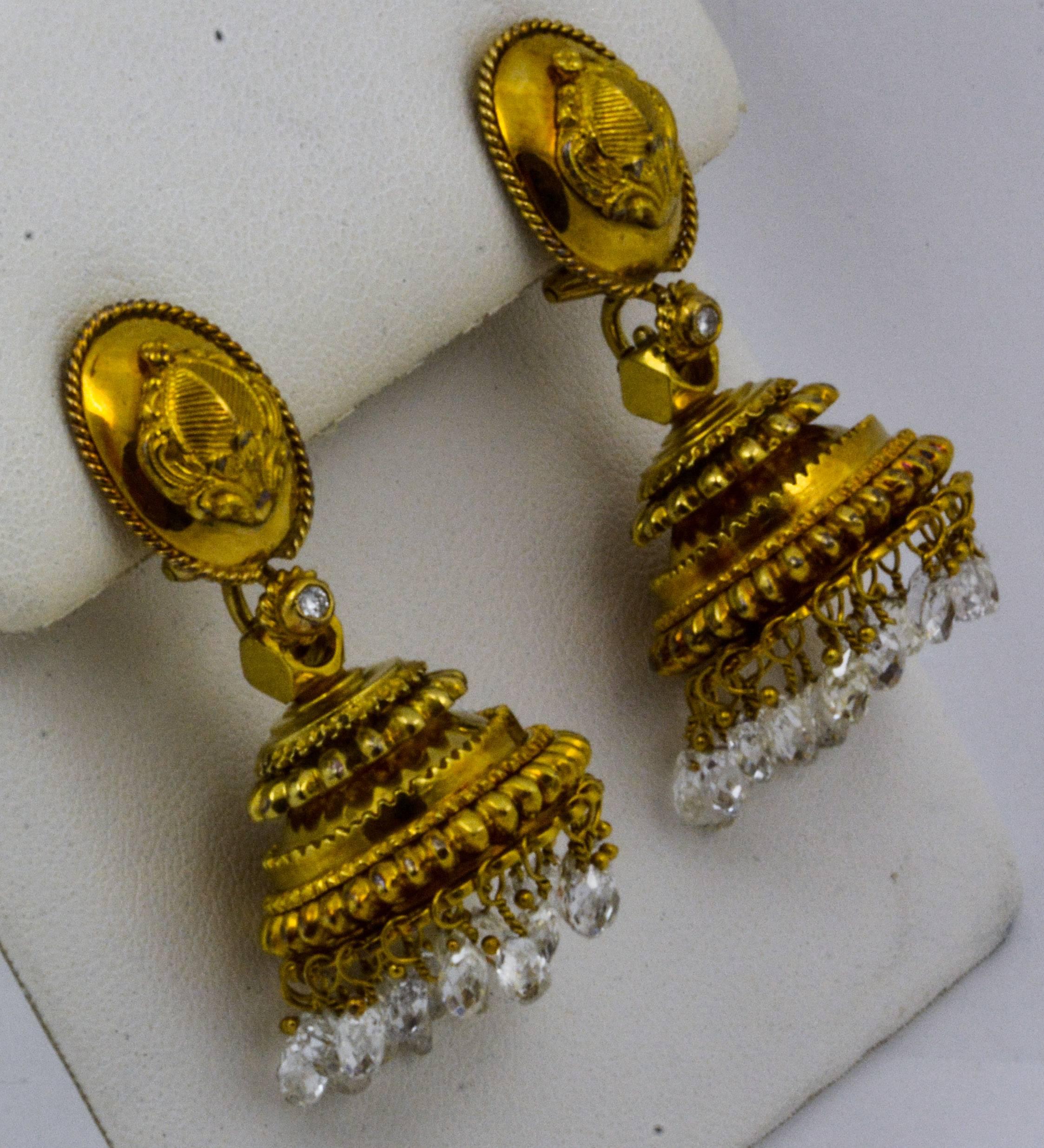 The understated sophistication of these chandelier earrings is terrific for day or night, and every hour in between. Fashioned from 18kt yellow gold and adorned with 14.5 carats of briolette cut diamonds, these chandelier clip-on earrings are a