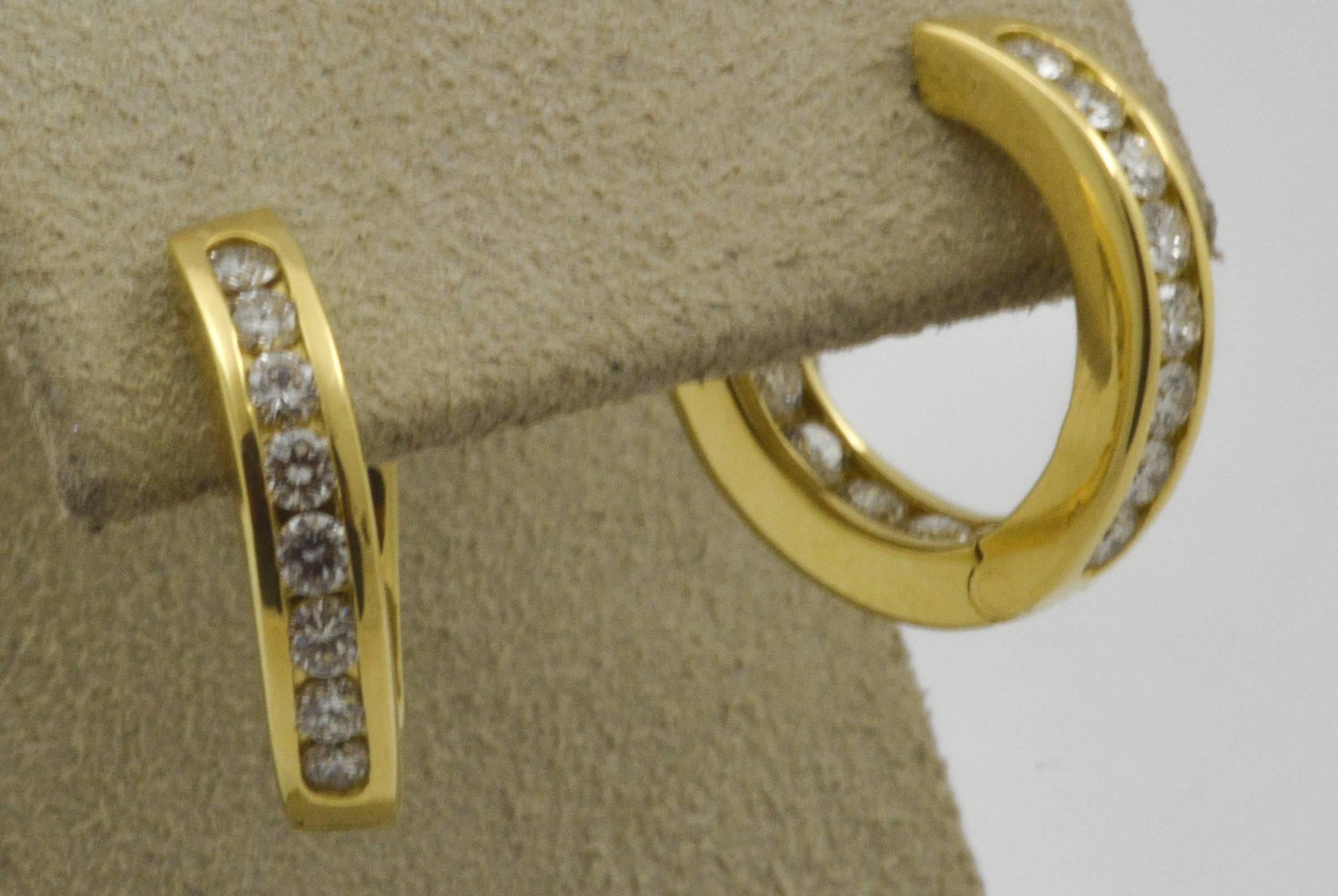 These classic 18kt yellow gold inside out diamond hoop earrings are each set with fourteen round, brilliant-cut diamonds in a channel setting style. With an approximate total weight of 0.24 carats (clarity VS color G), these earrings make a