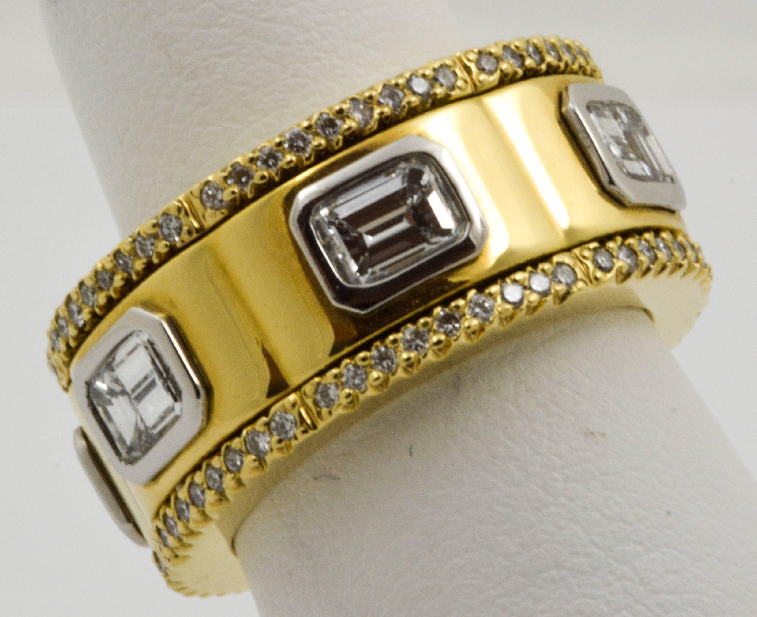 This beautiful Michael B 18 karat yellow gold and platinum diamond band is bezel-set with six emerald-cut diamonds that have an approximate total weight of 2.46 carats with G-H color and VS clarity. The band features a bolt style design, and its