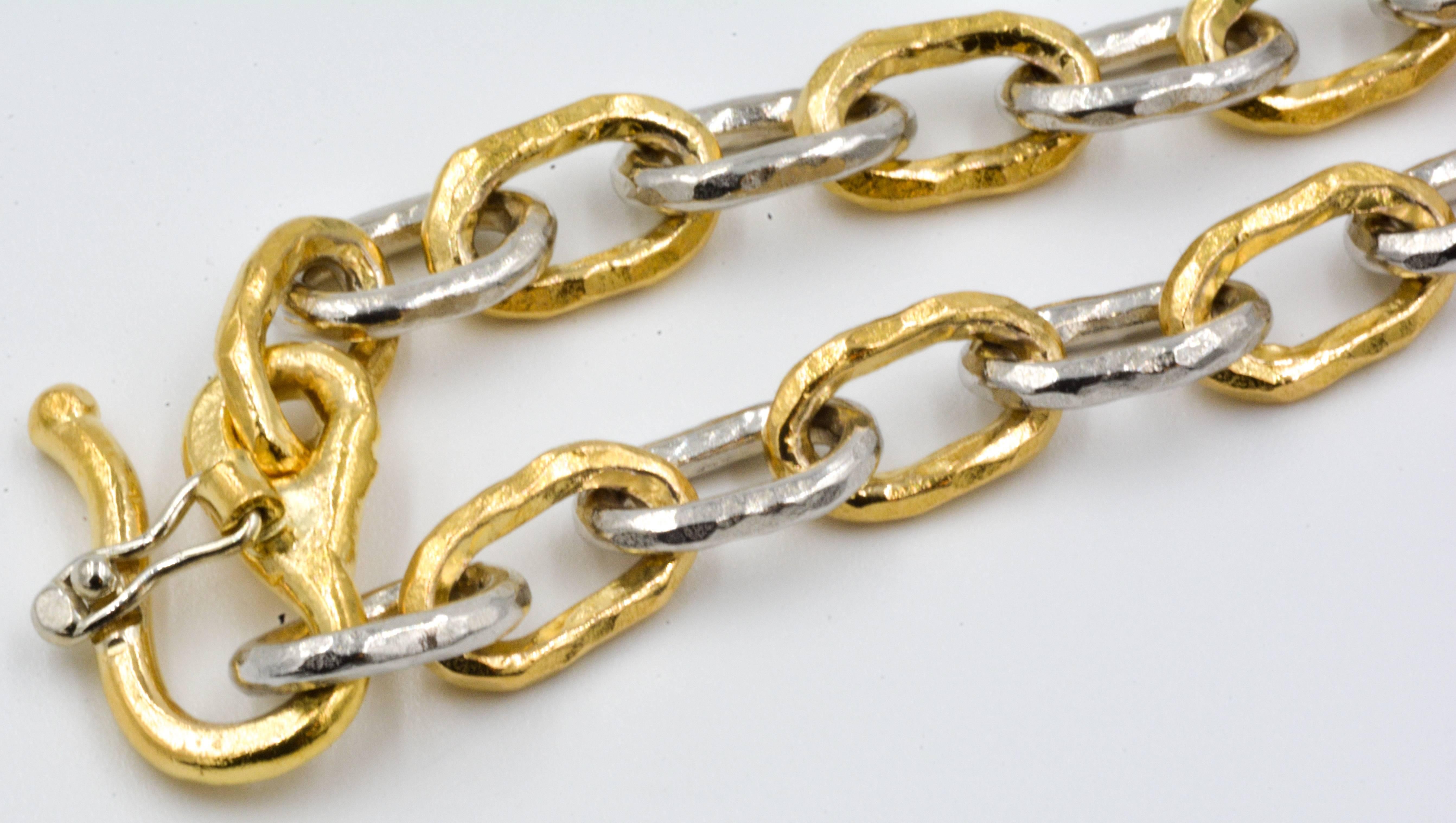 This lovely Jean Mahie bracelet features classic 22kt yellow gold and shimmering platinum. The links are crafted in the signature primitive hammered finish that has made Jean Mahie famous. The gold and platinum contrast beautifully, making this