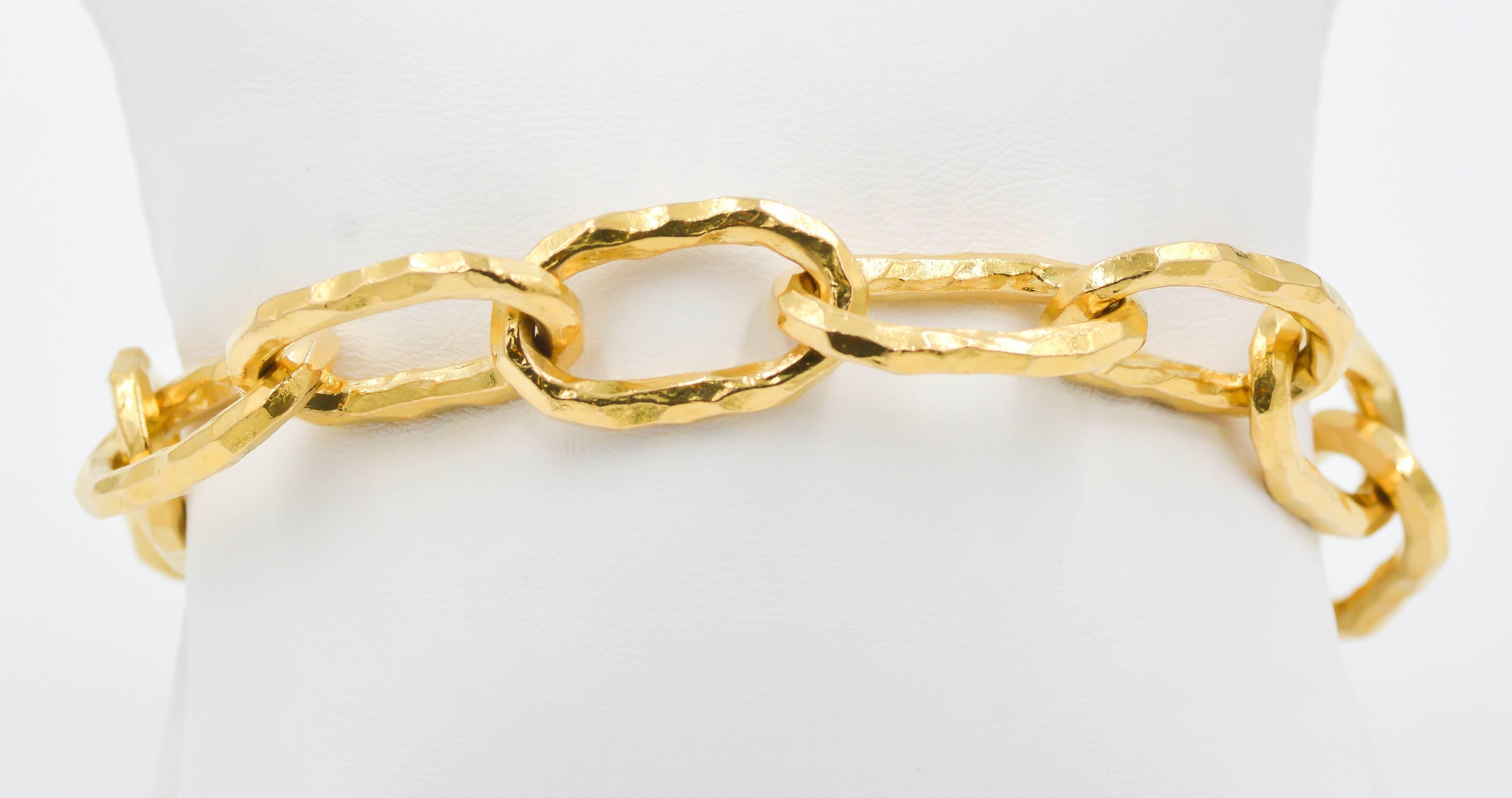 This classic Jean Mahie Large Cadene chain bracelet features the primitive style hammered finish that has made Jean Mahie famous on its 22kt yellow gold links. These beautiful cadene chains are comfortable to wear and are always sure to be noticed.