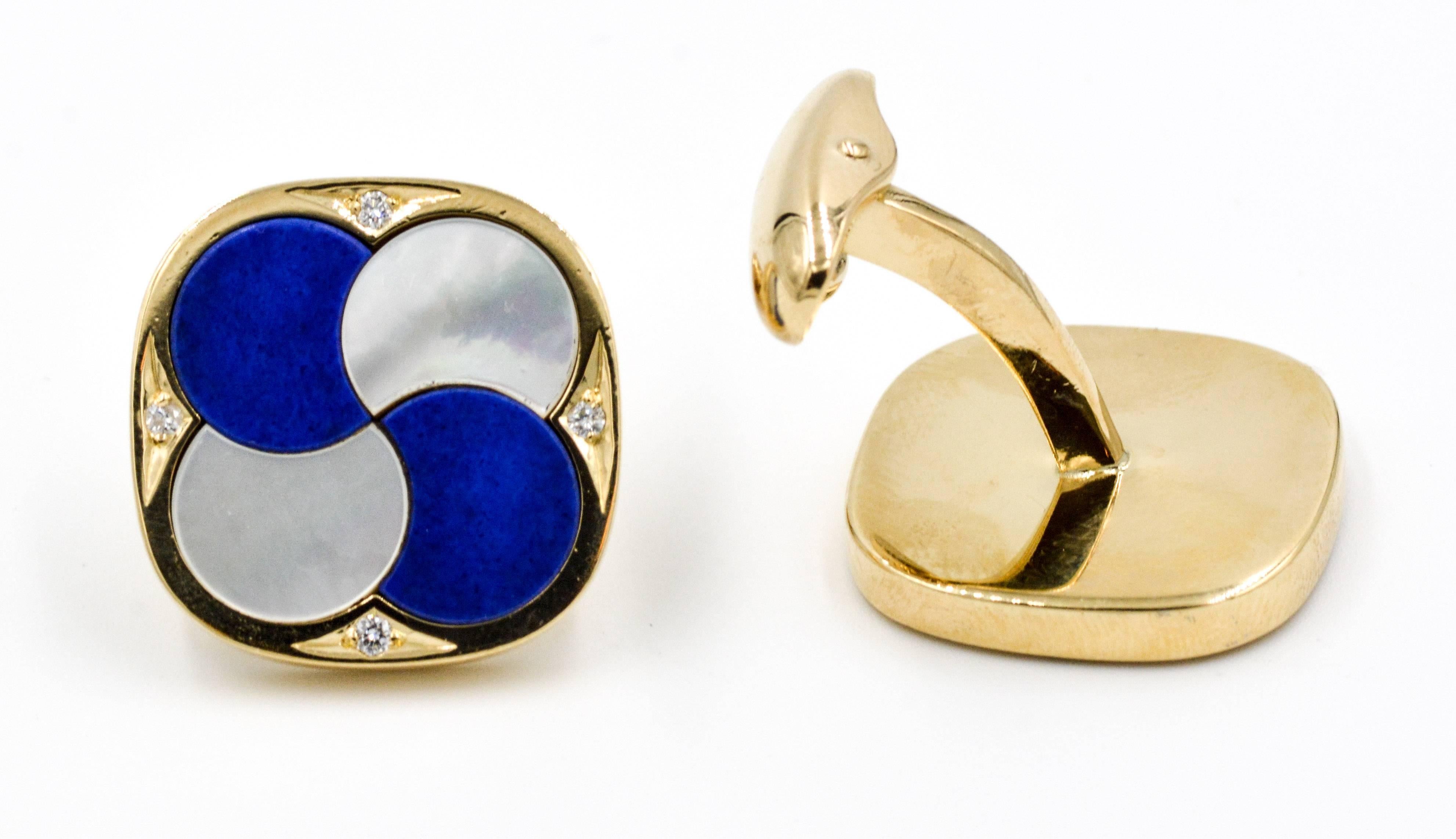 These amazing 18kt yellow gold cuff links are set with beautifully contrasting white mother of pearl and rich blue lapis lazuli circles that overlap as the spiral around the center of these cushion shaped cuff links.  Accenting these cuff links are