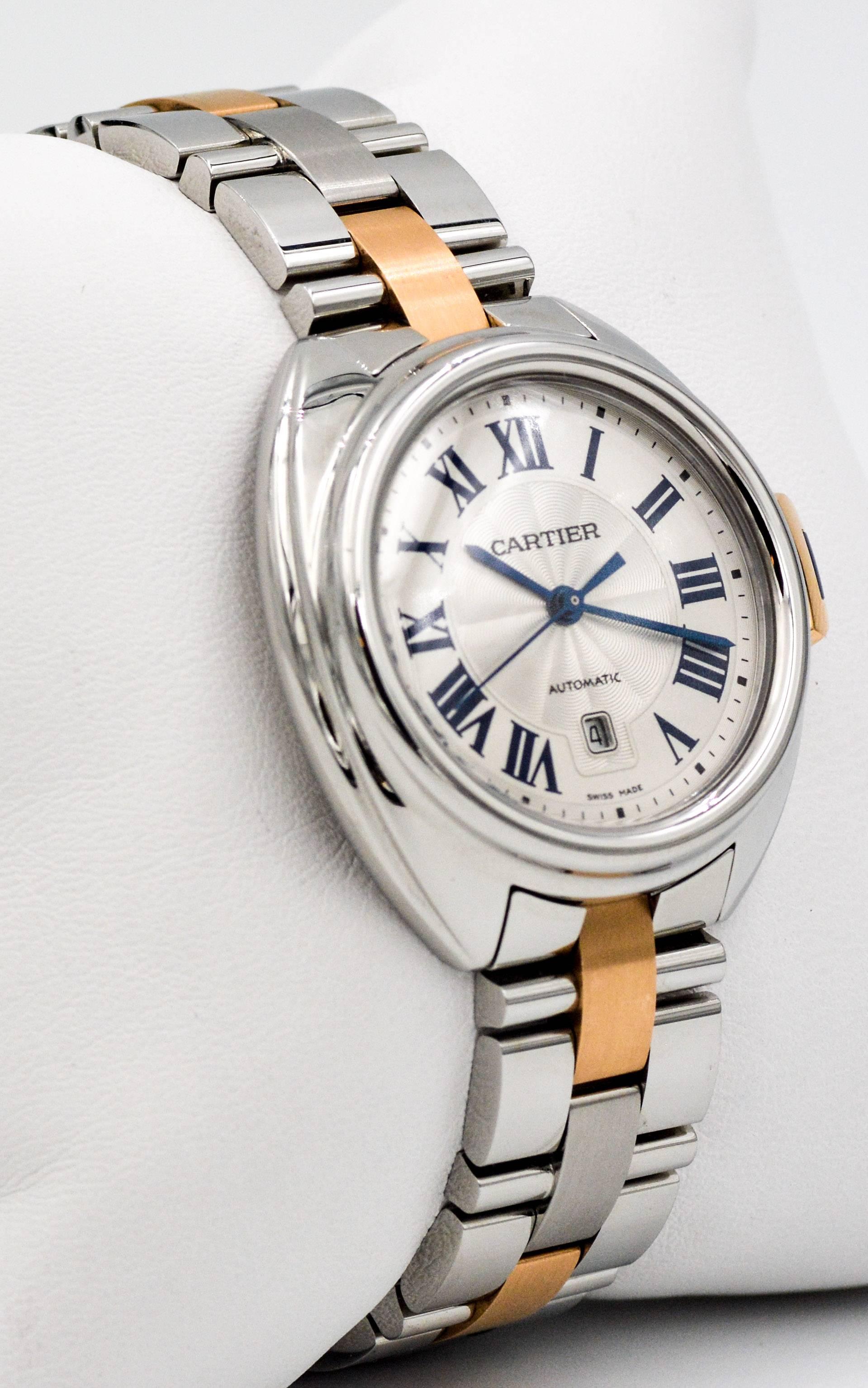 Cle de Cartier is a watch for women exuding soft curves, clean lines and a rounded profile. Cartier exhibits a minimalist elegance in this classic 18kt yellow gold and stainless steel Cle De Cartier 31 mm case, and radiantly textured silvered dial