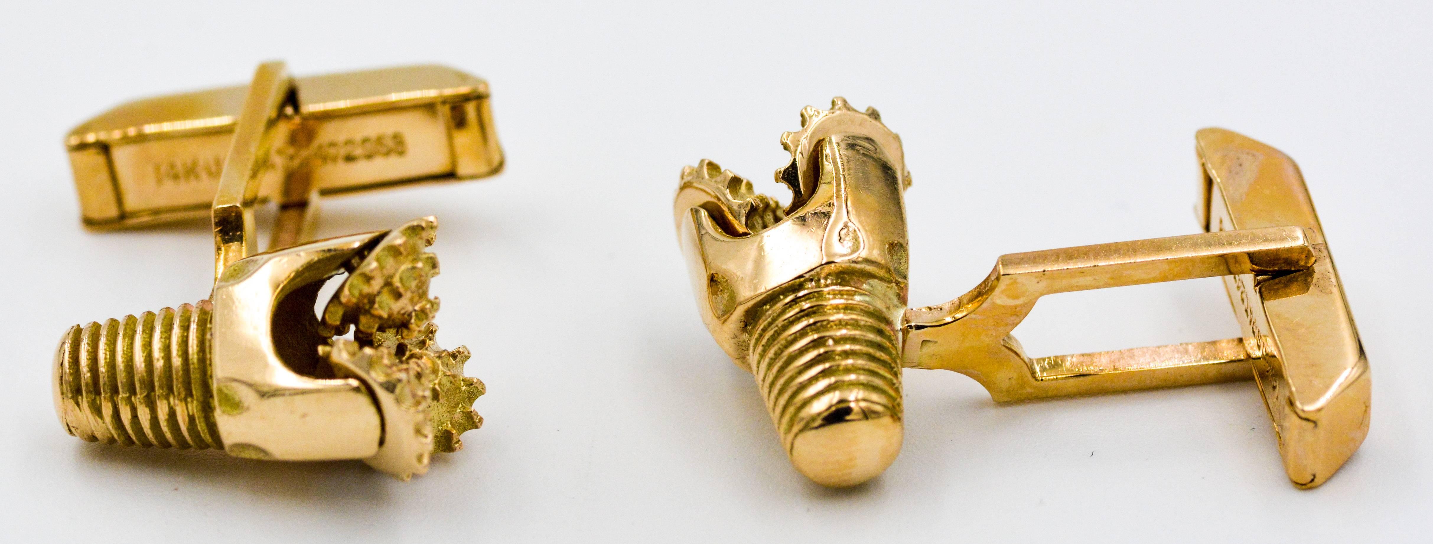 These interesting and masculine Oil Rig Drill Bit cuff links are made of 14kt yellow gold and have a three rotating bit base.  The cuff-links also have the screw attachment at the back of the drill design.  These Oil Rig Drill Bits are mounted on a