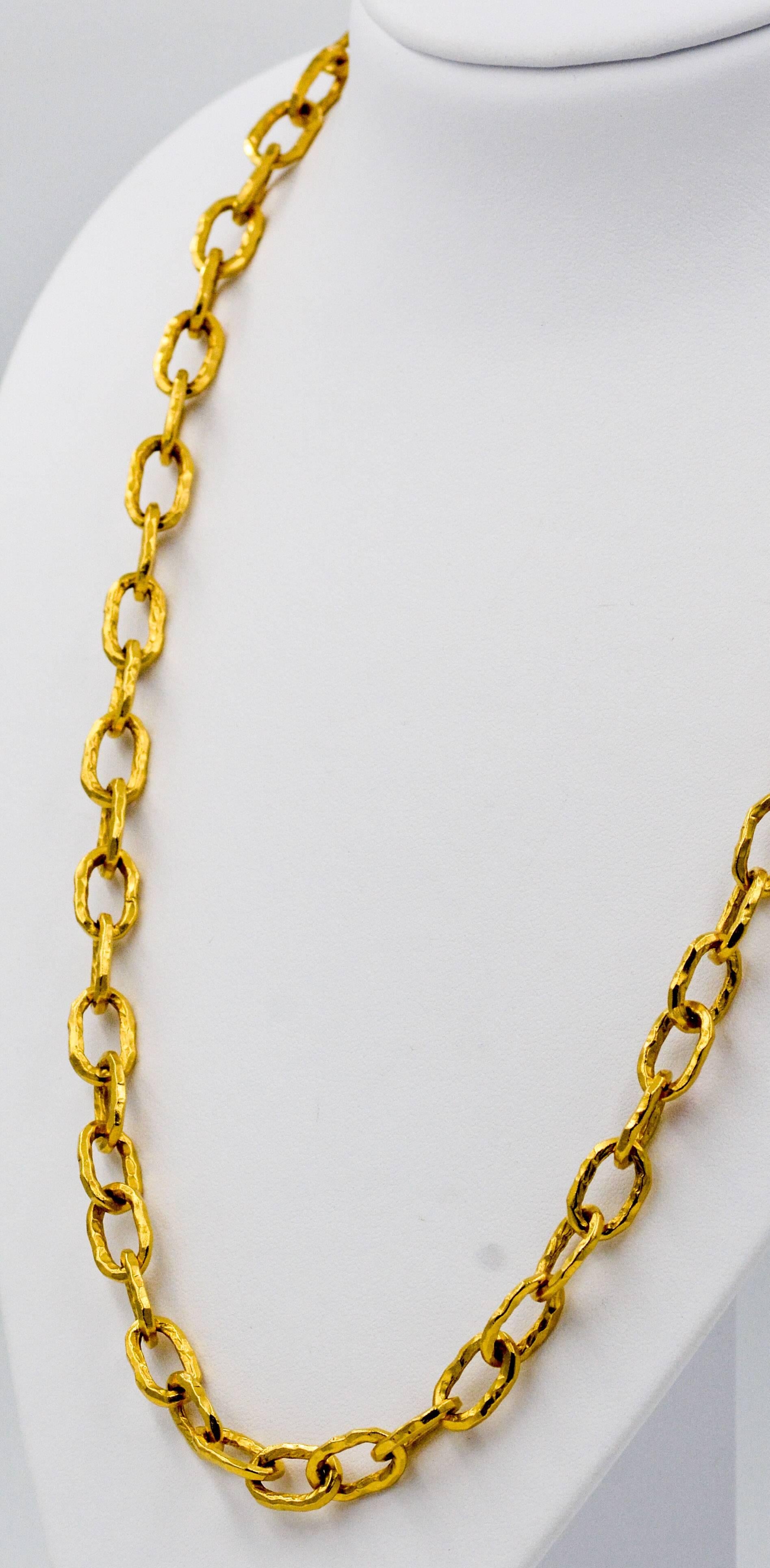 This amazing Jean Mahie medium cadene necklaced is artfully crafted using 22K yellow gold and measures 32 inches long.  Jean Mahie finished the medium cadene necklace in her signature style of rich primitive hammer finished oval links.  The links
