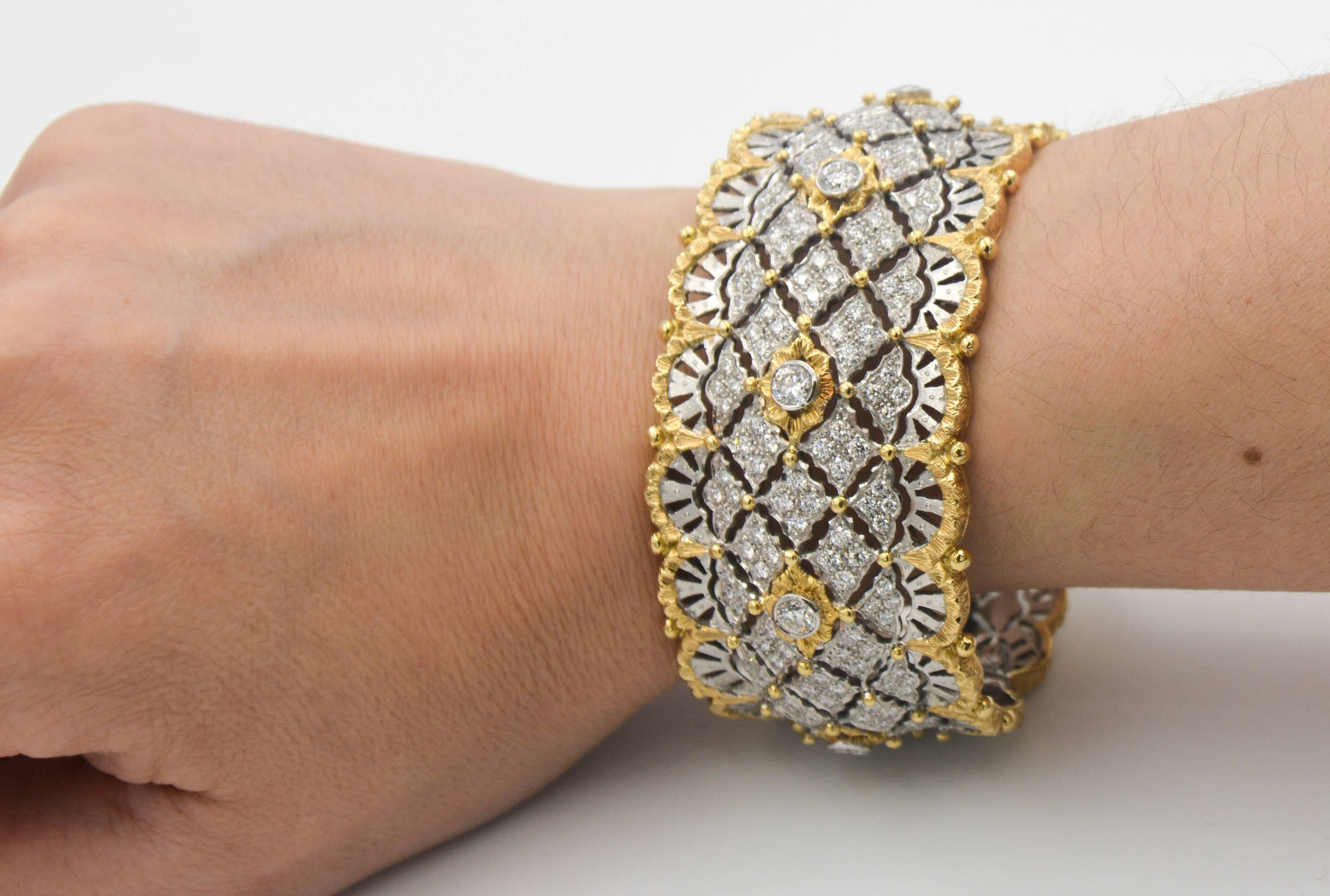 Beautiful Italian cuff bangle bracelet in 18kt white gold and 6.15ctw worth of diamonds, and 18kt yellow gold accents and scalloped trim.  This exquisite bracelet features a double hinged back for ease of wear.  