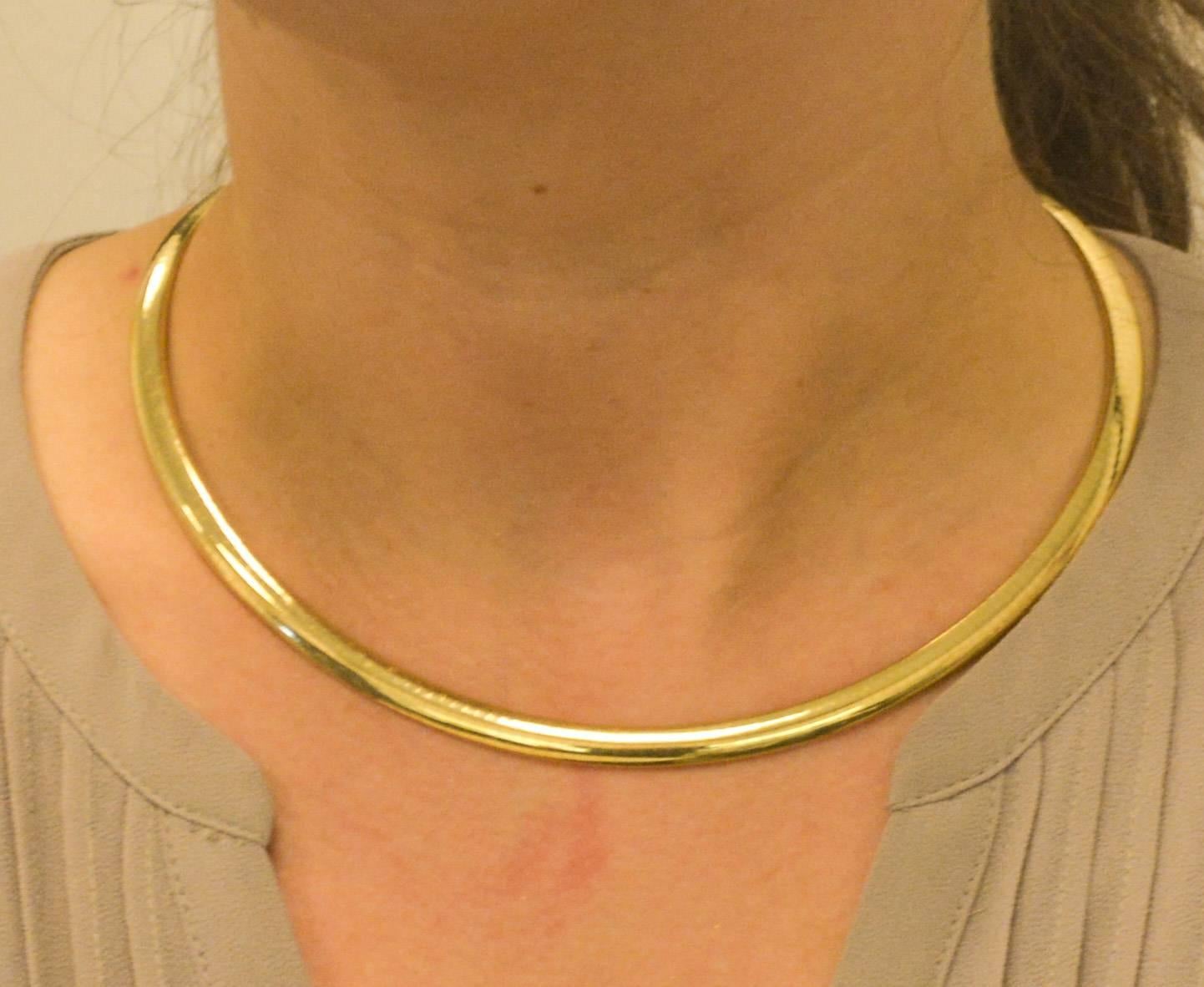 This timeless classic 14 karat Italian yellow gold Omega necklace, measuring 5.75mm in width, feels sleek and comfortable on the neck and looks just as good.  Measures 18 inches in length, and has met the Eiseman Jewels standard of excellence. 