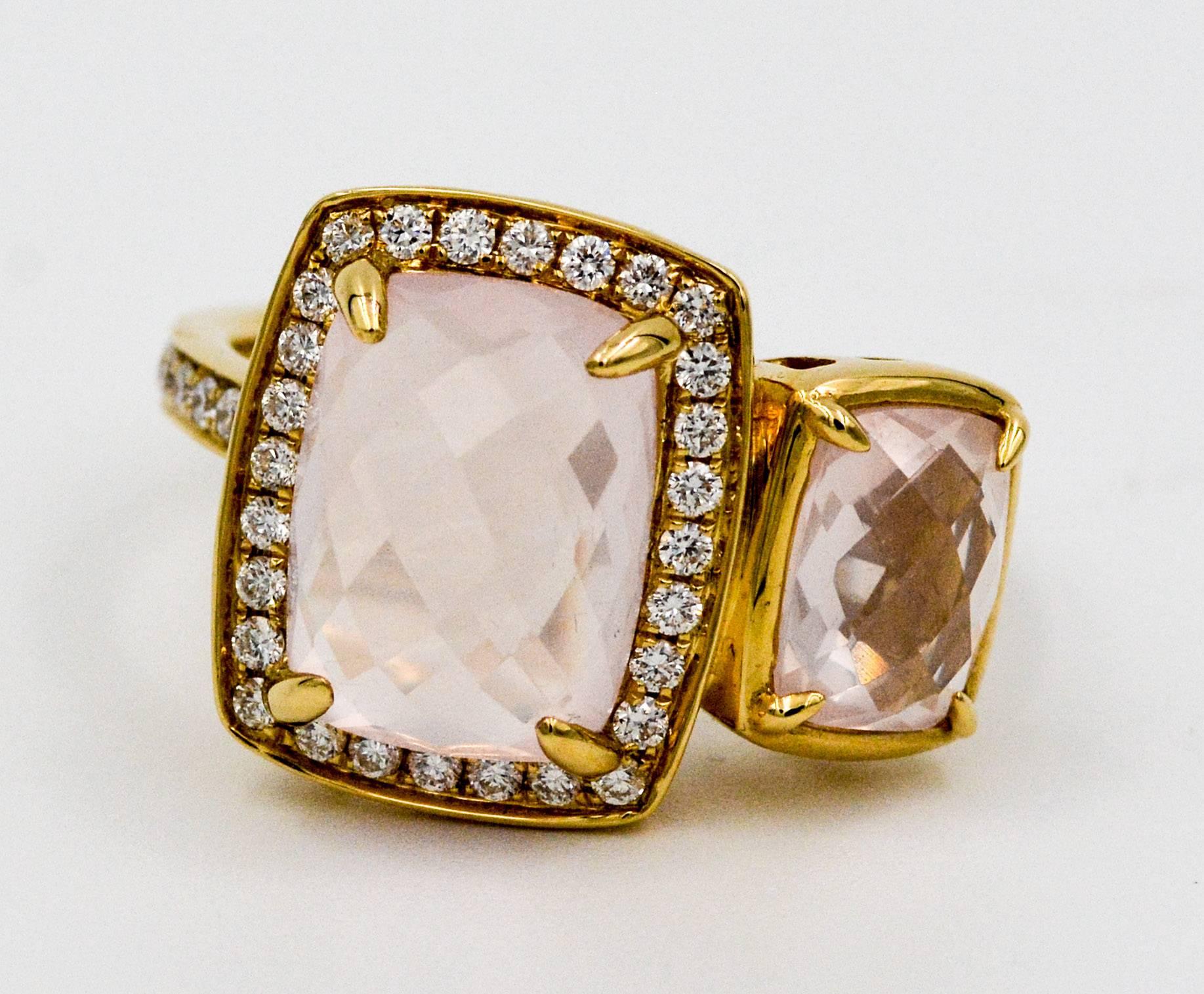 An elegant and showy modern asymmetrical 18 karat yellow gold ring from Katie Decker, set with two faceted cushion cut rose quartz, 5.50 carats total weight, and accented with round brilliant cut diamonds weighing .45 carat total. The diamonds are