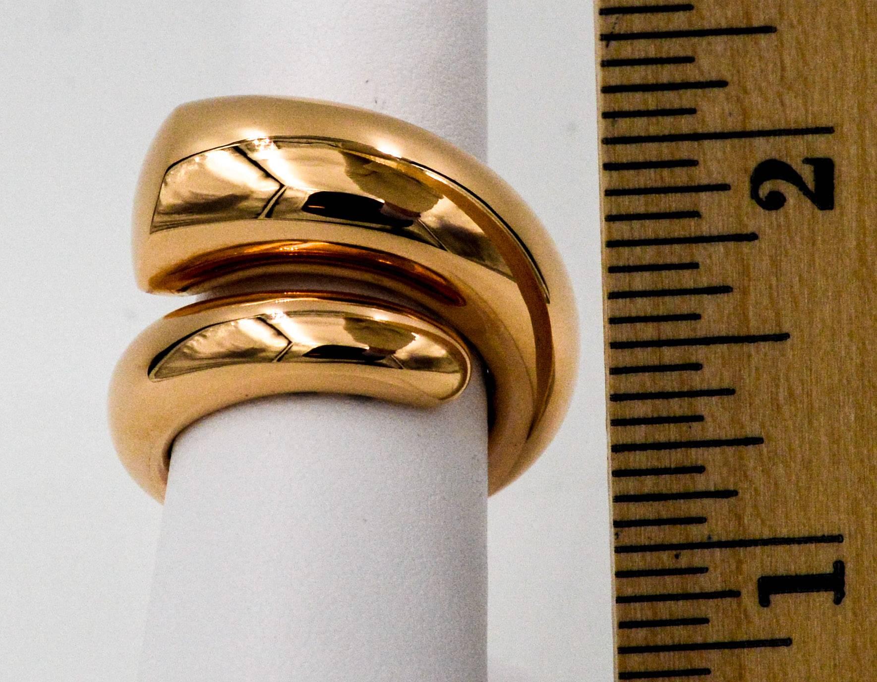 This beautiful Oromalia18kt pink gold ring is designed from a tapered domed concept that raps around the finger and passes by on the top.  It has a high dome with a high polish.  The inside of the ring is finished with a comfort fit open gallery