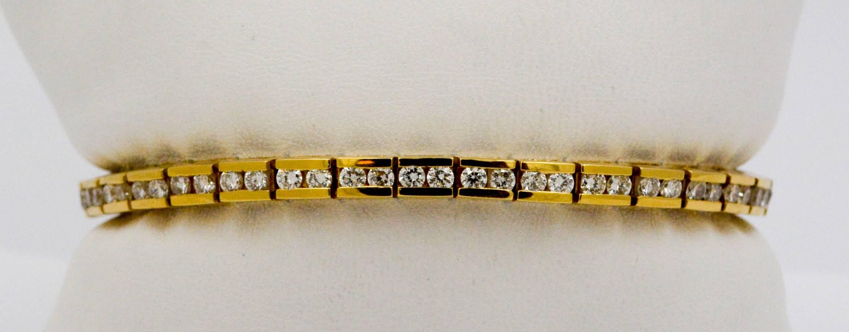 This classic tennis bracelet is desinged with a channel set design set with 66 round brilliant cut diamonds that have approximate combined weight of 3.50 carats with H-I color and SI clarity.  Each link in this classic line bracelet is expertly set