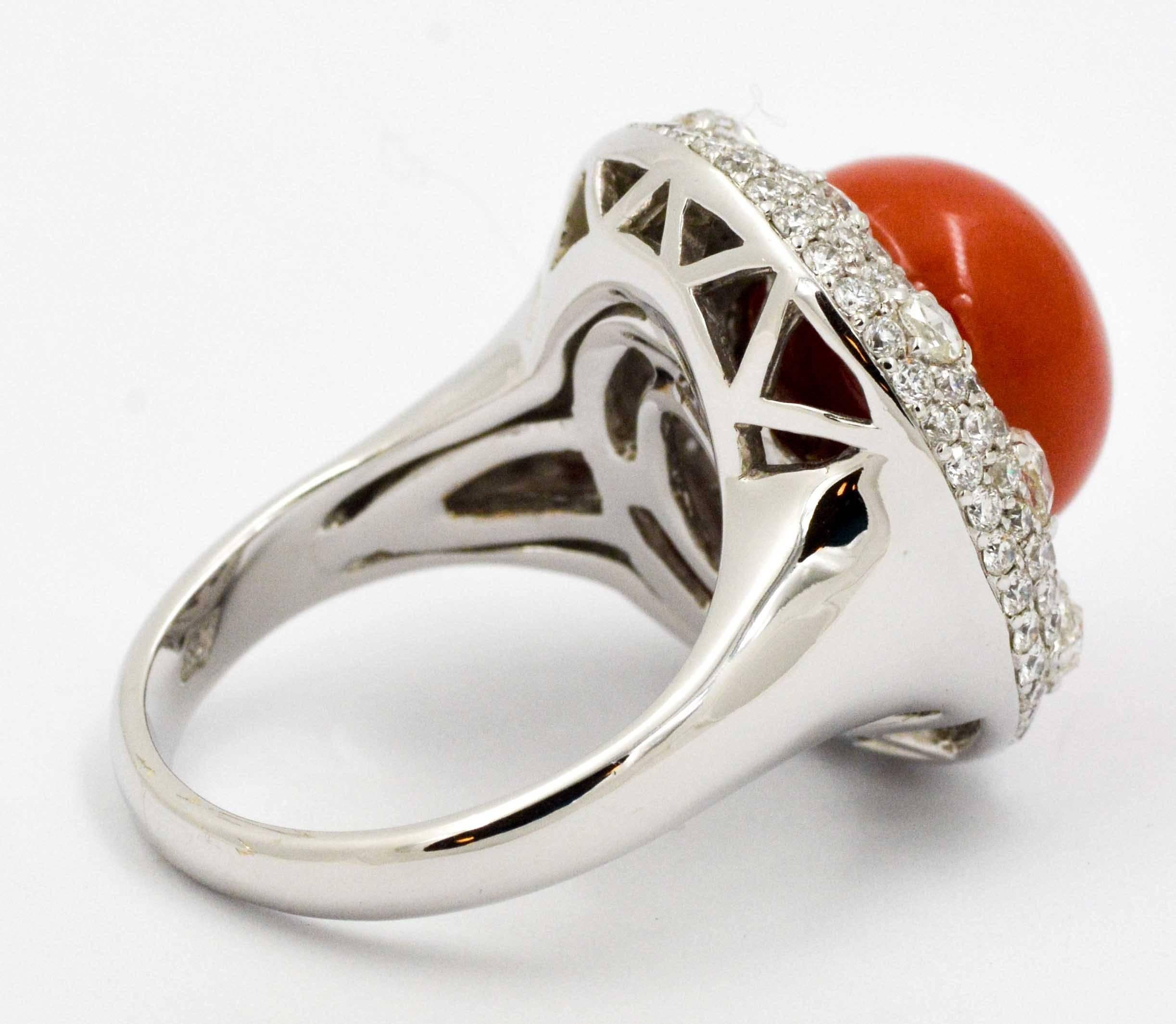 The perfect blend of sophistication and romance describe this stunning 18 karat white gold Torro Del ring with an amazing 12.34 mm red coral bead in its center. This red coral is vibrant in its color saturation.  The red coral is accented with a