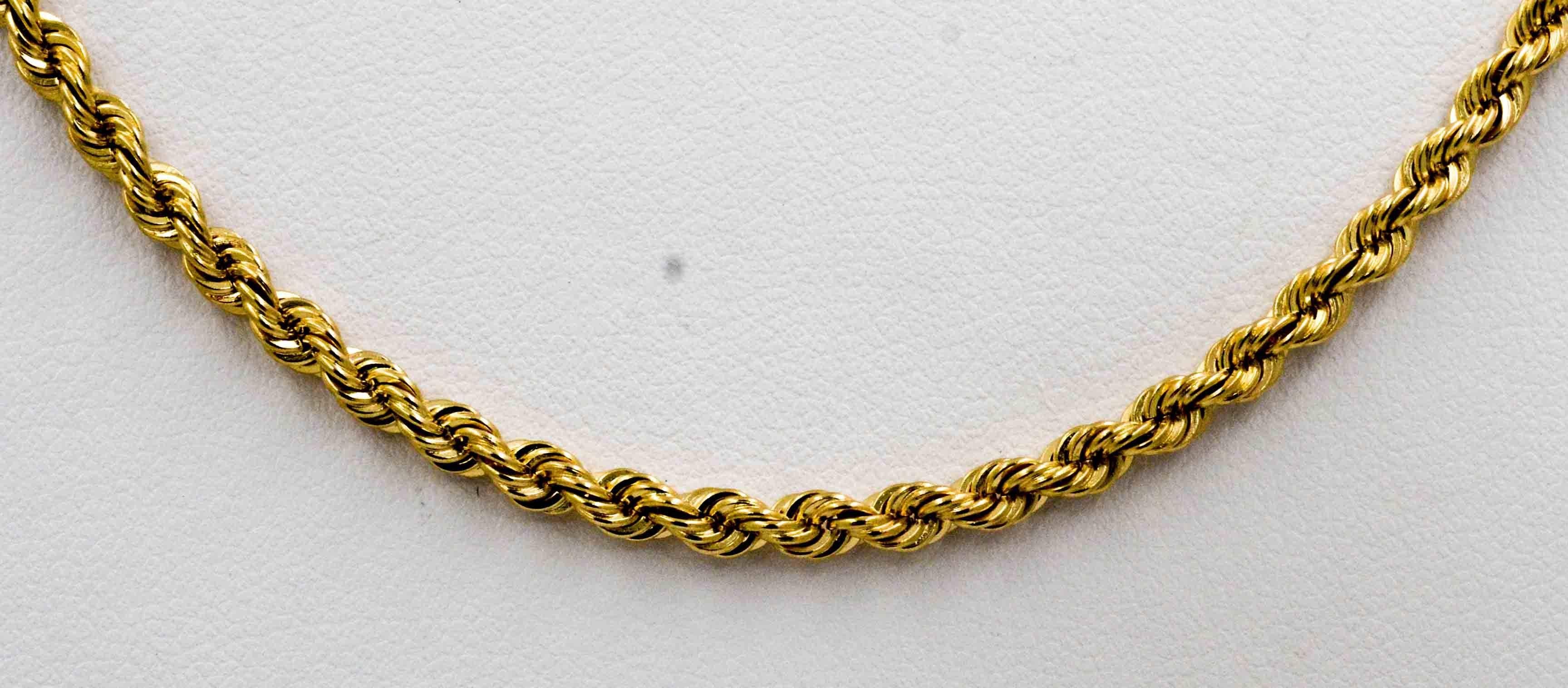 Enjoy the clear simplicity of a classic 14kt yellow gold rope chain that is 3 mm thick and 24 inches long.  The chain is closed with a 14kt yellow gold barrel clasp.