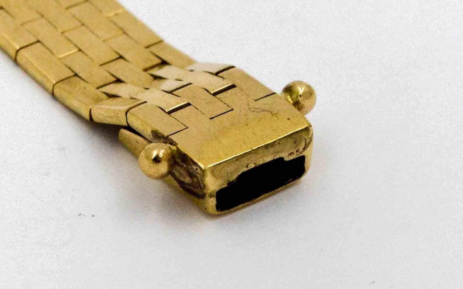 So rich, smooth and soft, this classic brick link bracelet is the definition of comfortable.  The piece measures 7.75 mm wide and 7 inches long.  The shiny gold bracelet is clasped with a box and tongue clasp.  The brick link bracelet has a high