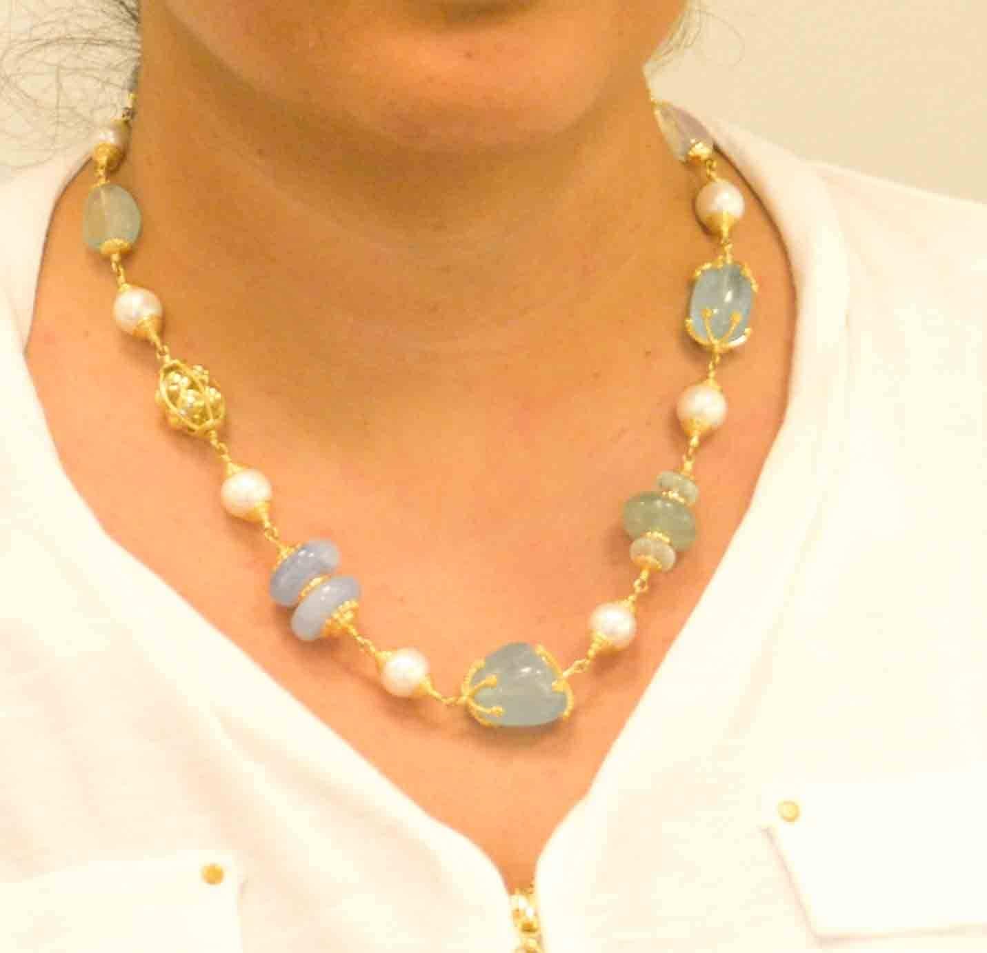 This amazing Seaman Schepps necklace is constructed of 18kt yellow gold and features a variety of semi precious gemstones.  These gemstones are selected in the typical Seaman Schepps character, using stones of amazing color and contrast.  The