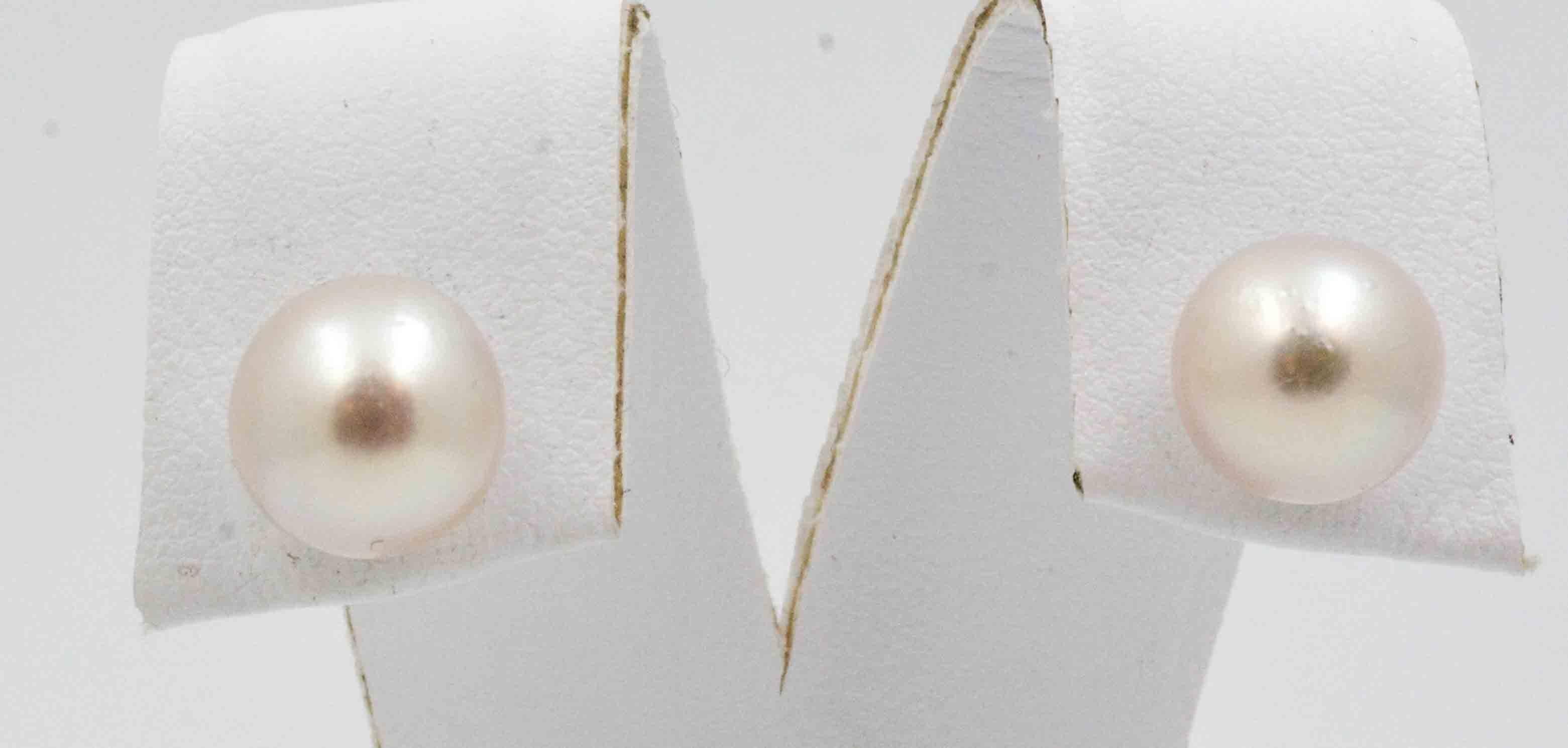 Whether dressing for day or night, these 18 kt yellow gold Cultured Pearl earrings will compliment your style. 9x9.5 mm Cultured Pearls set in 18kt Yellow gold posts. 