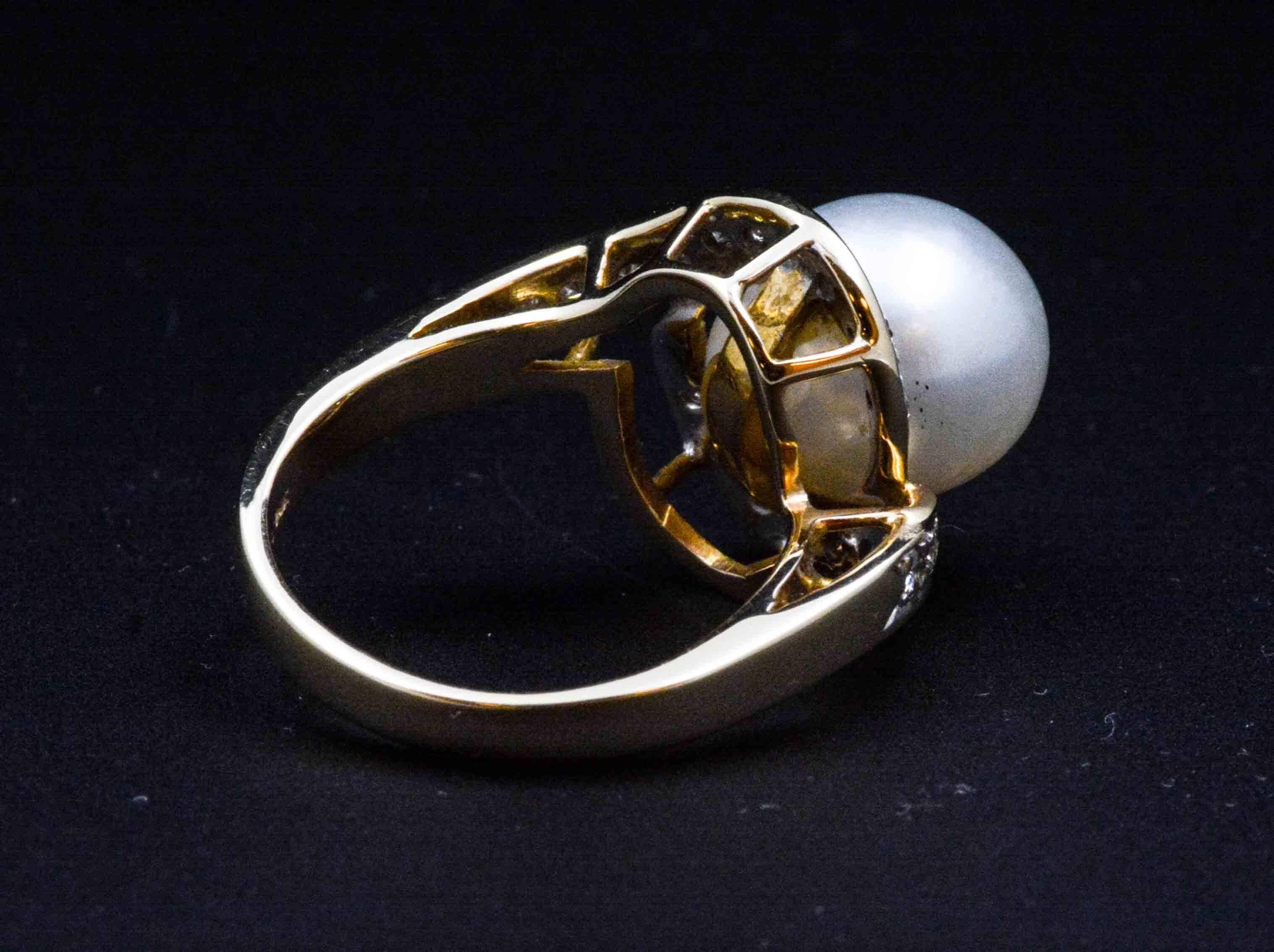 Sharing the spotlight are brilliant diamonds complementing an opulent cultured pearl. Not only is this pearl ring sophisticated, but it is also interesting to look upon. A lovely 10.55 mm white cultured pearl surrounded by 20 round brilliant cut