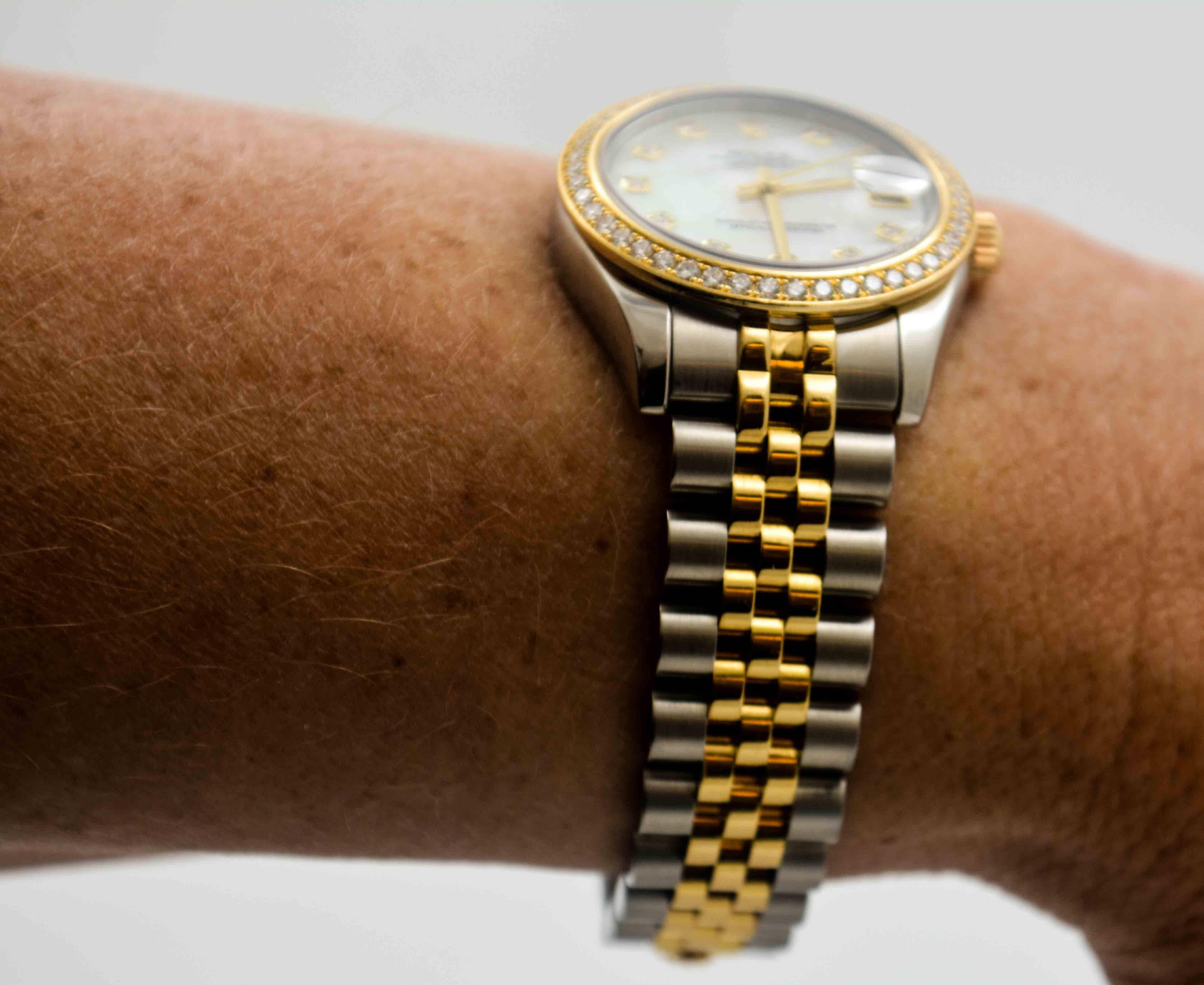  One of the most recognized and recognizable of watches, this ladies Rolex Datejust Watch is crafted in 18kt yellow gold and stainless steel for high luster and shine, as well as strength and durability. The 18 kt Rolex Diamond bezel adds a