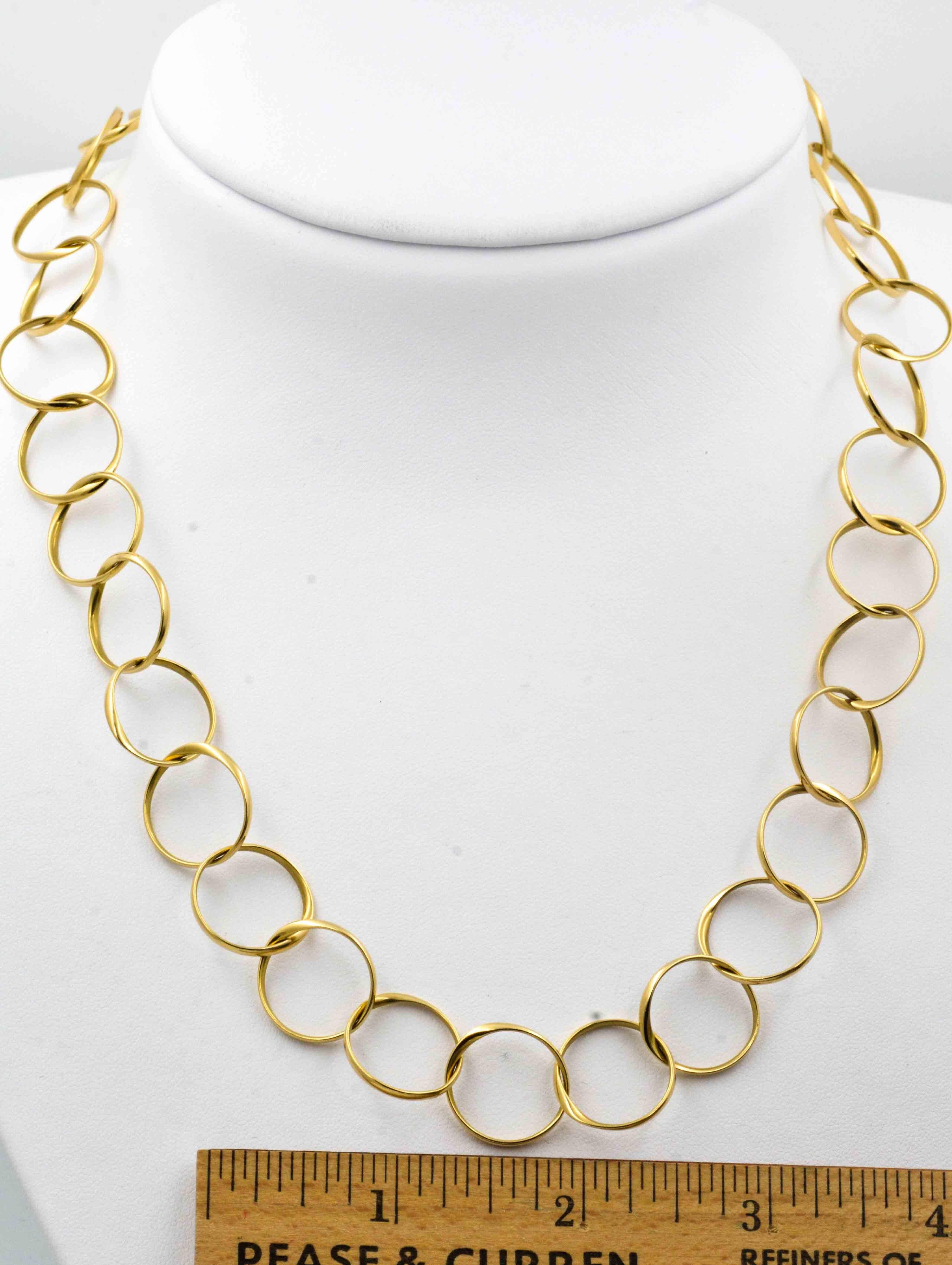 Whimsical and light, this circle link chain will add finesse to any outfit. Made in 18 Kt yellow gold, this chain measures 20 inches in length. 