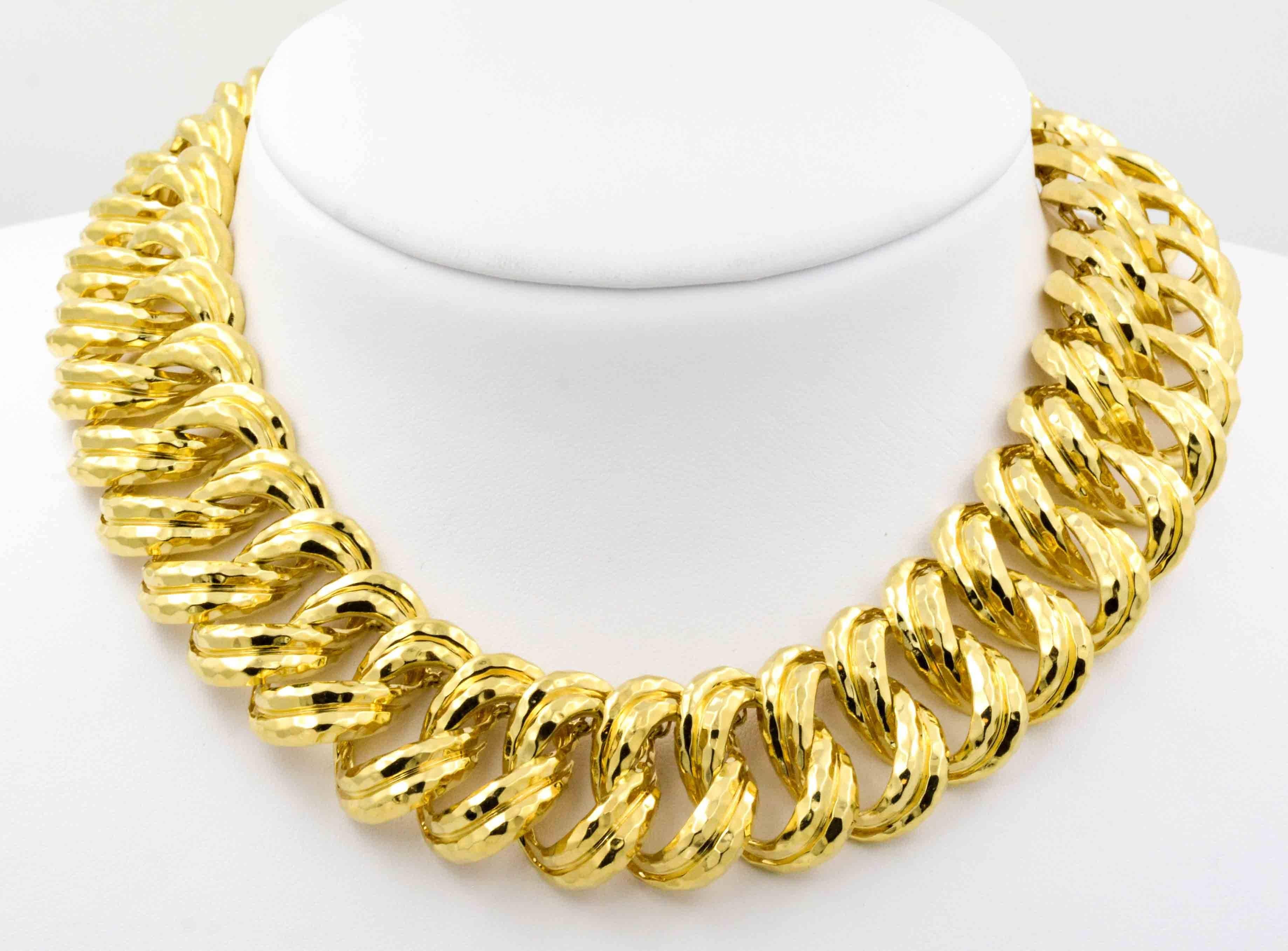 Like an amber sunset glowing in the evening, this 18 kt yellow gold necklace ripples of gold adding an upscale touch to the neckline. Created by Henry Dunay in his signature bold 18 kt gold style, the facets of this necklace are both intriguing as