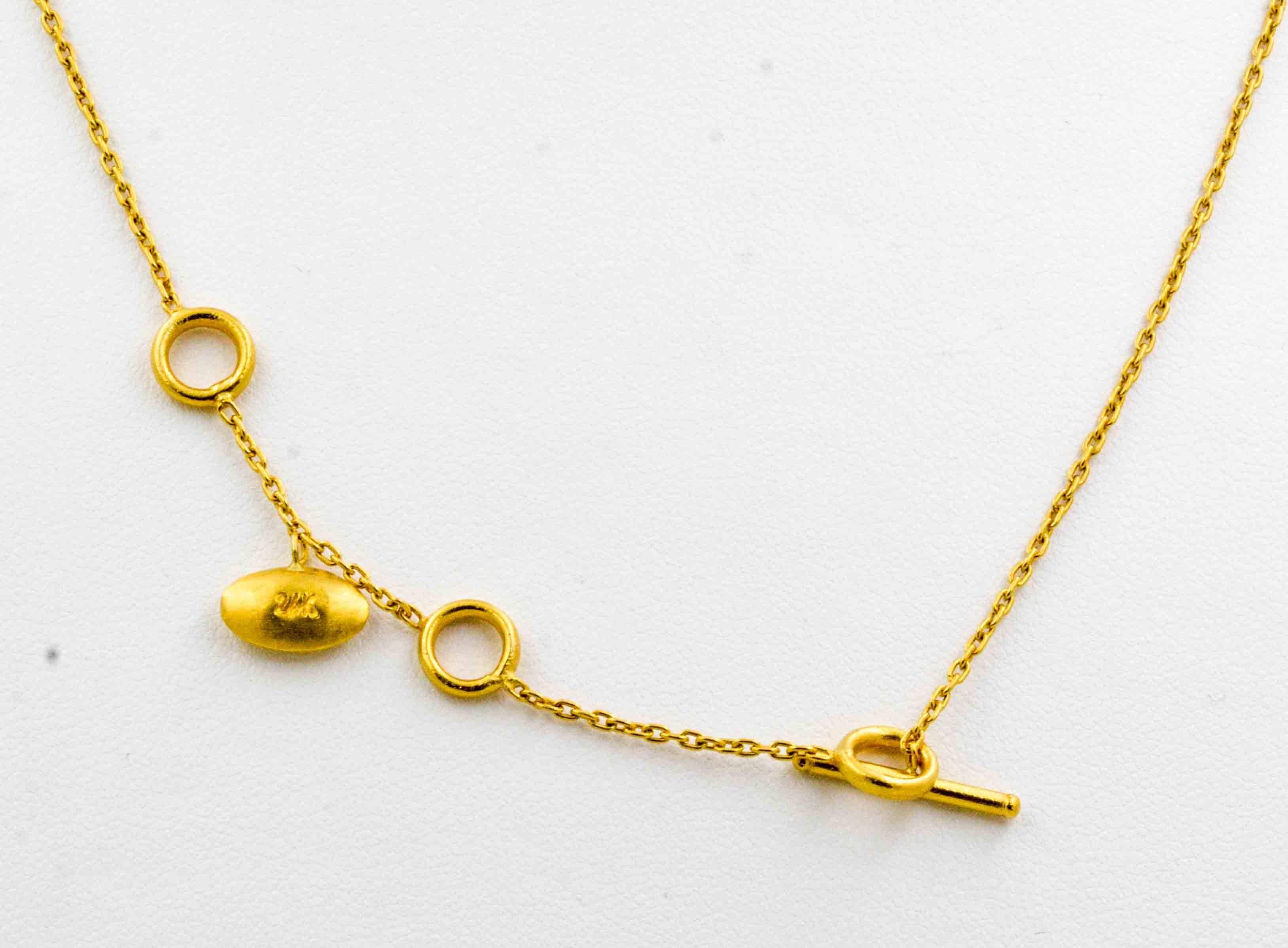Lika Behar uses bright 24 karat yello8105926w gold in her Etruscan jewelry designs. This Lika Behar "Krissy" necklace with center oxidized sterling silver pendant has 0.24 ctw diamonds set in a flower design. The exquisite 24 karat yellow