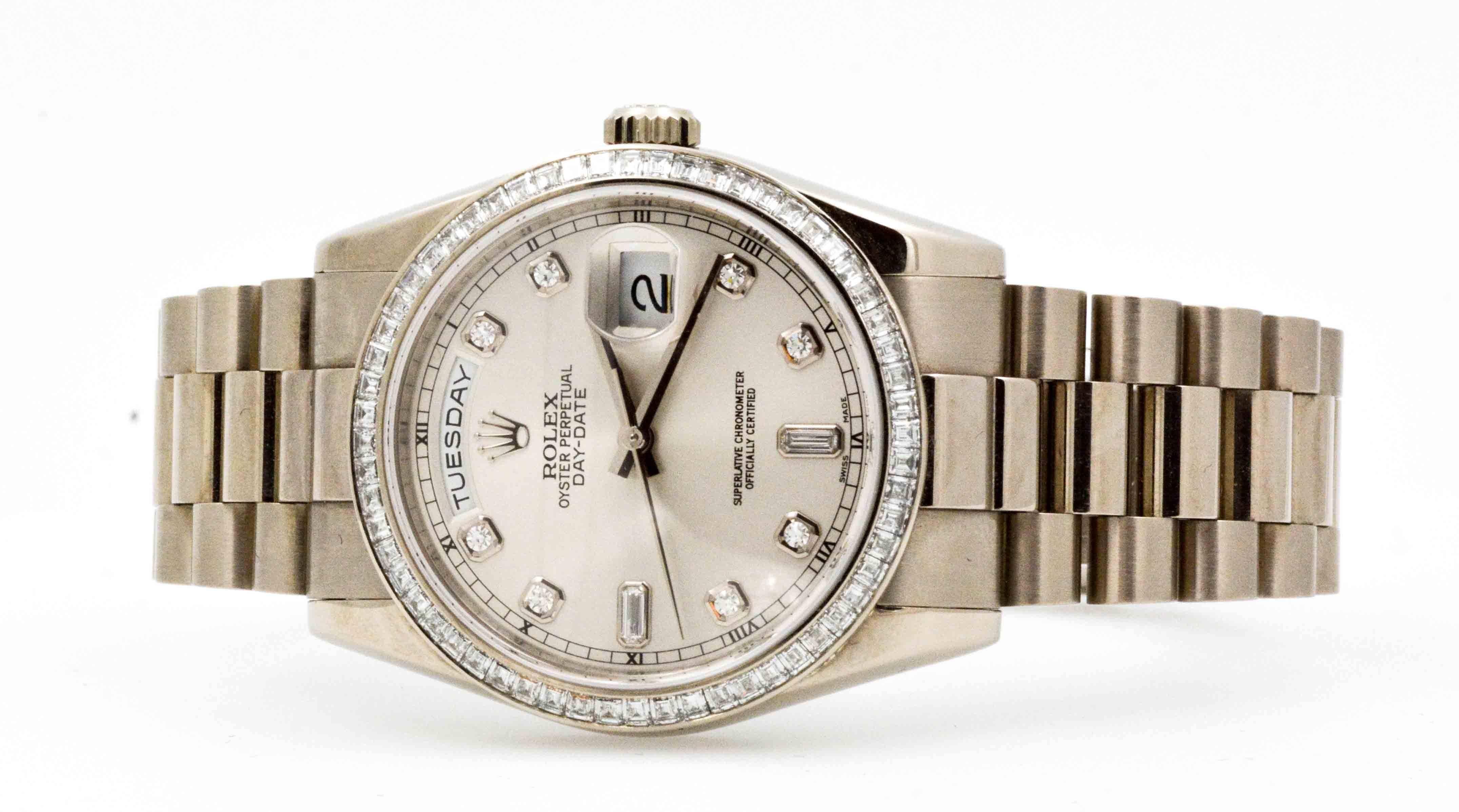 A sensational 18 karat white gold Rolex Presidential Day Date watch with a presidential bracelet and glittering baguette diamond bezel could be yours! This Presidential Rolex Day Date watch has a white dial set with eight round brilliant cut
