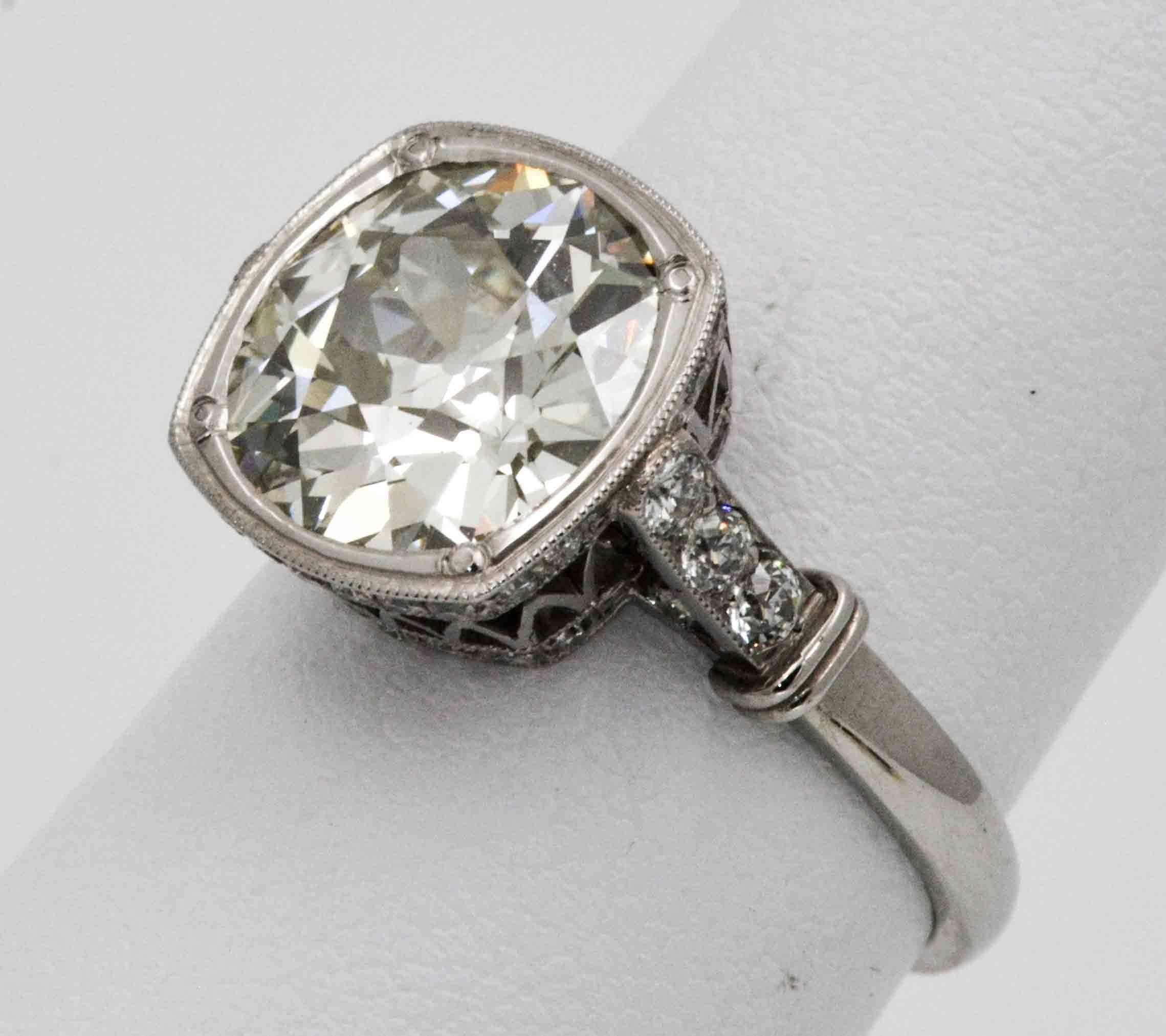The drama of the Art Deco era comes to life in this newly created 1920's European cut diamond ring. The intricate platinum lattice crown work holding this old 3.86 ct European cut diamond (K color VS2 clarity, no certificate) was created by Single