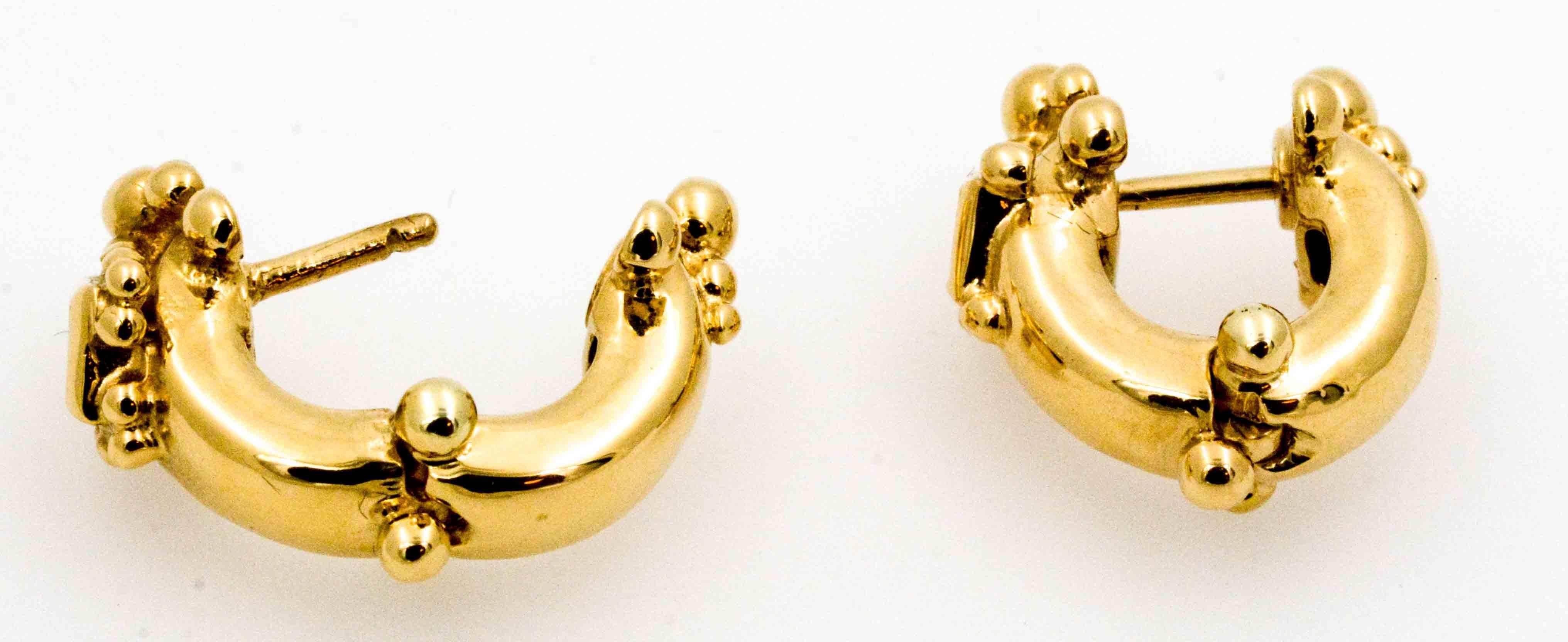Have you ever had something so glamorous hug your ears? These sensational Loree Rodkin huggie hoop earrings are crafted in shiny 18 karat yellow gold, with two dazzling  princess cut diamonds (0.24 ctw H color, VS1 clarity).