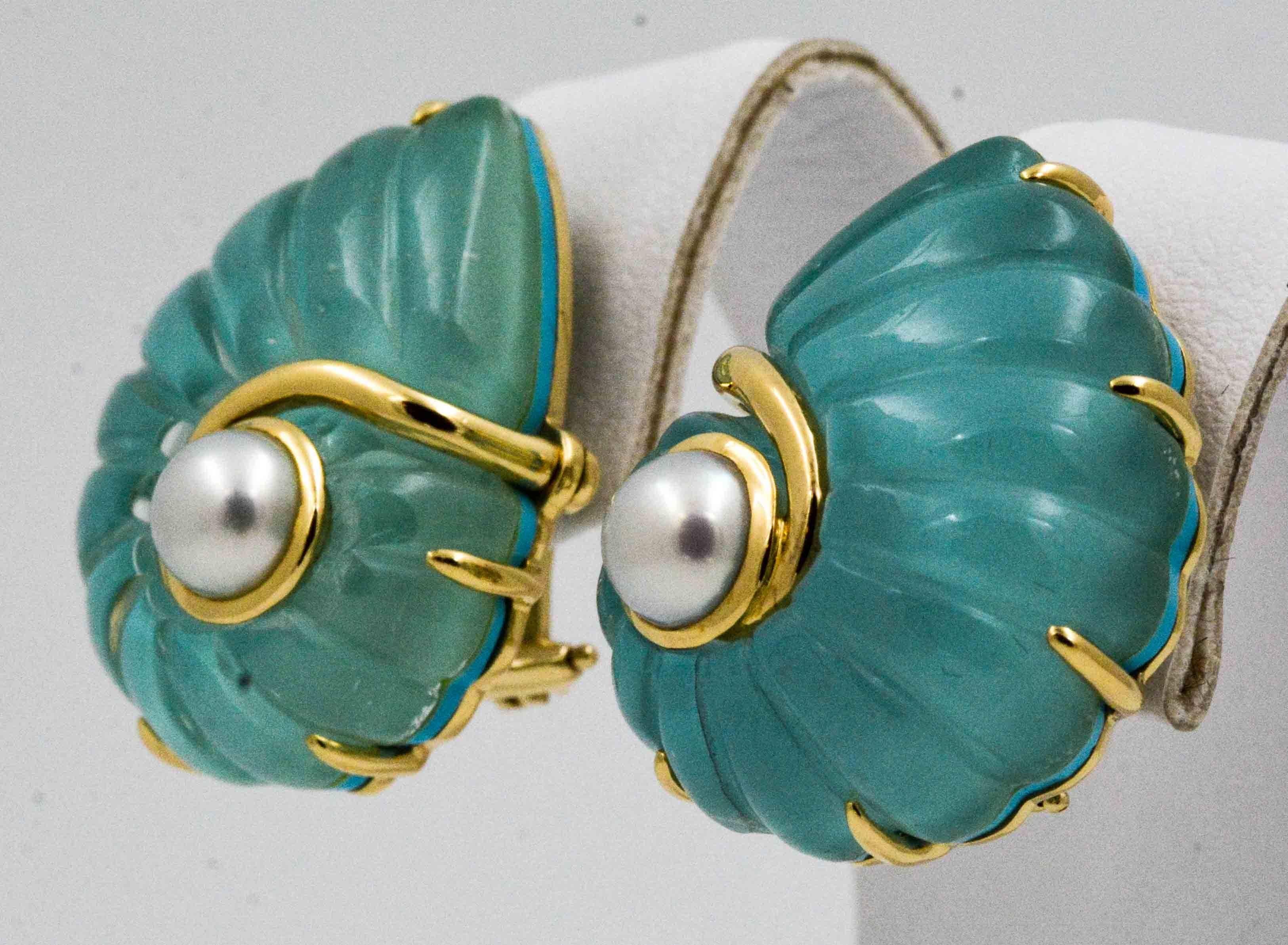 An adventure awaits in these nautical Seaman Schepps Trianon earrings crafted from carved rock crystal with turquoise backing accentuated by two pearls. These clip on earrings will remind you of gathering seashells on the beach along blue Caribbean