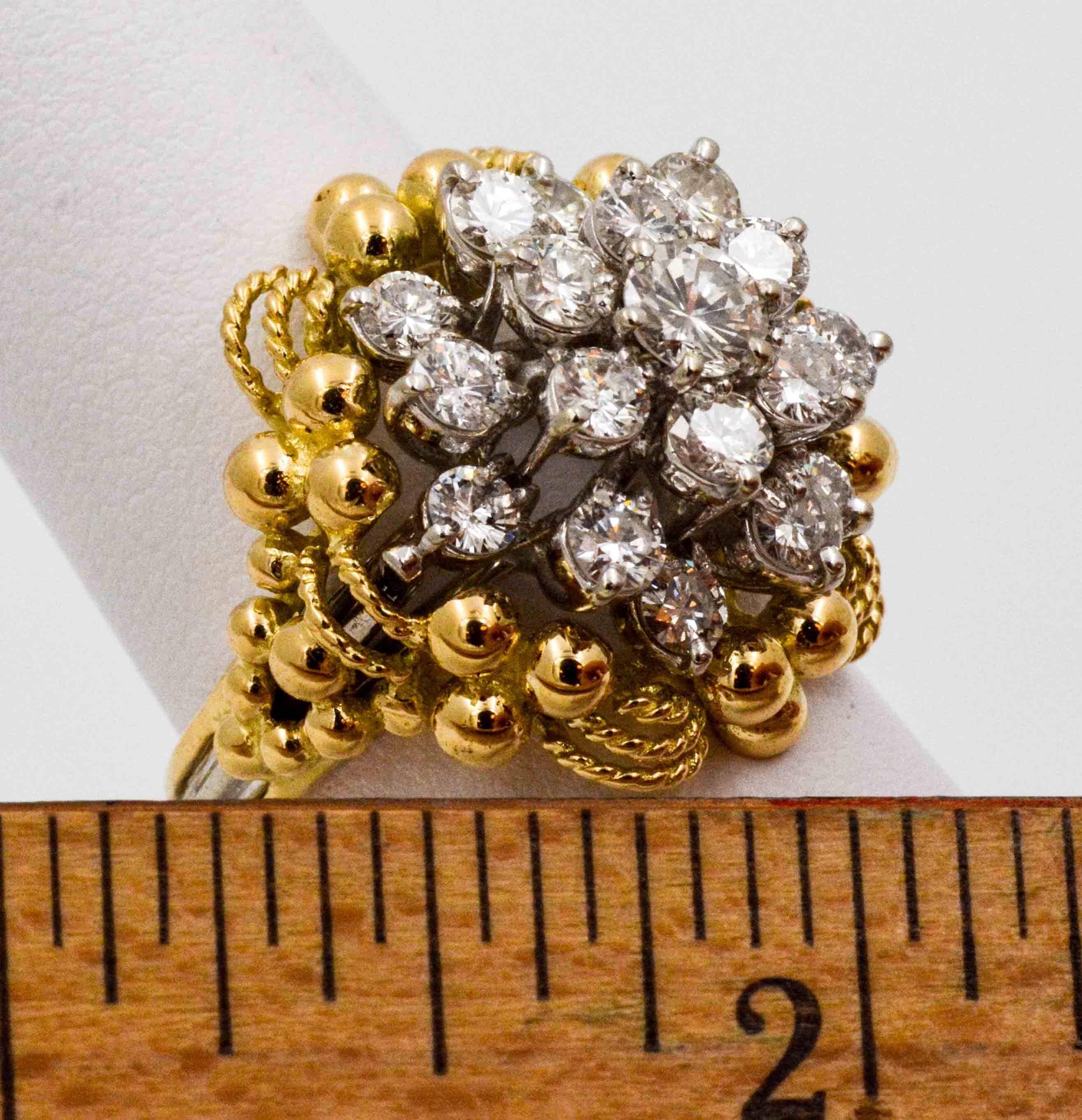 Nestled sweetly in this impressive cluster ring are 19 round brilliant cut diamonds ready for a night out! Crafted in both 14 karat white and yellow gold, this cluster ring is both dazzling and elegant. The diamonds weigh 2.0 Carats total weight (I