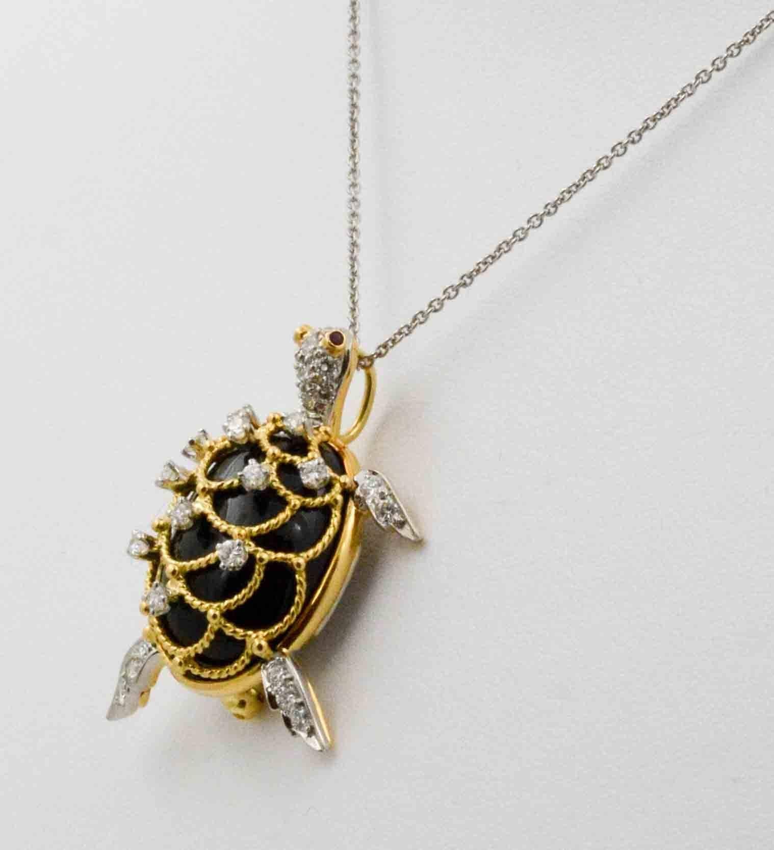 A captivating sea turtle, created by Hammerman Brothers in New York City, has scallops of 18 karat yellow gold. Scattered throughout the scallops on his tiny shell, on his feet as well as head, are 29 round brilliant cut diamonds (0.48 carats) set