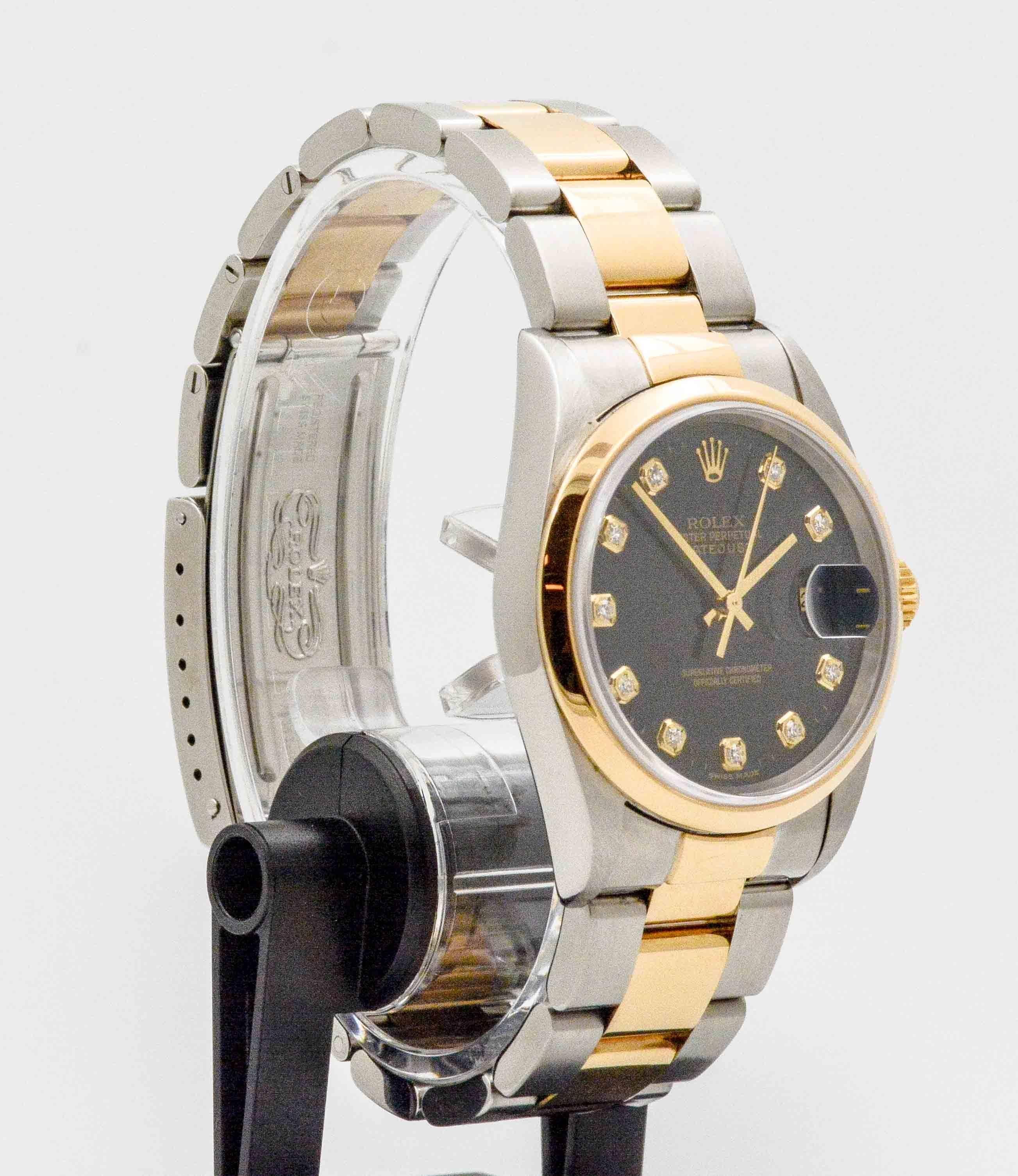 An elegant Certified Pre-Owned Rolex Datejust, 16203 - Men's automatic winding wristwatch. Stainless steel case with 18k yellow gold smooth bezel. Black dial with factory diamond hour markers. 36 mm. Stainless steel and 18k yellow gold Oyster