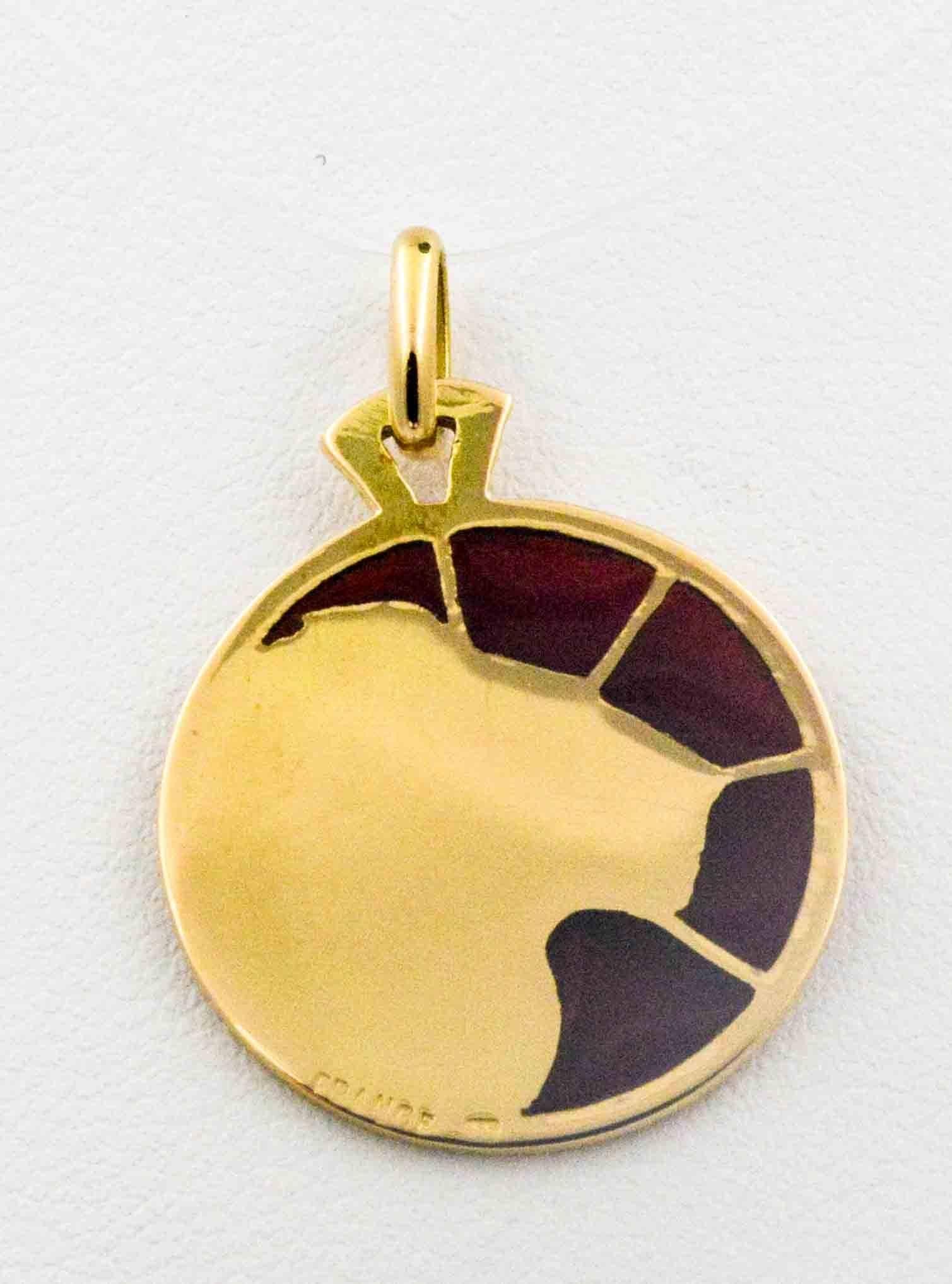 In a dark brown background, the zodiac sign, Leo, is  crafted in hues of deep gold enameled glass. The master craftsman in the art of Plique a Jour hand crafted this Leo in a delicate 18 karat yellow gold pendant with lightweight enameled glass. 