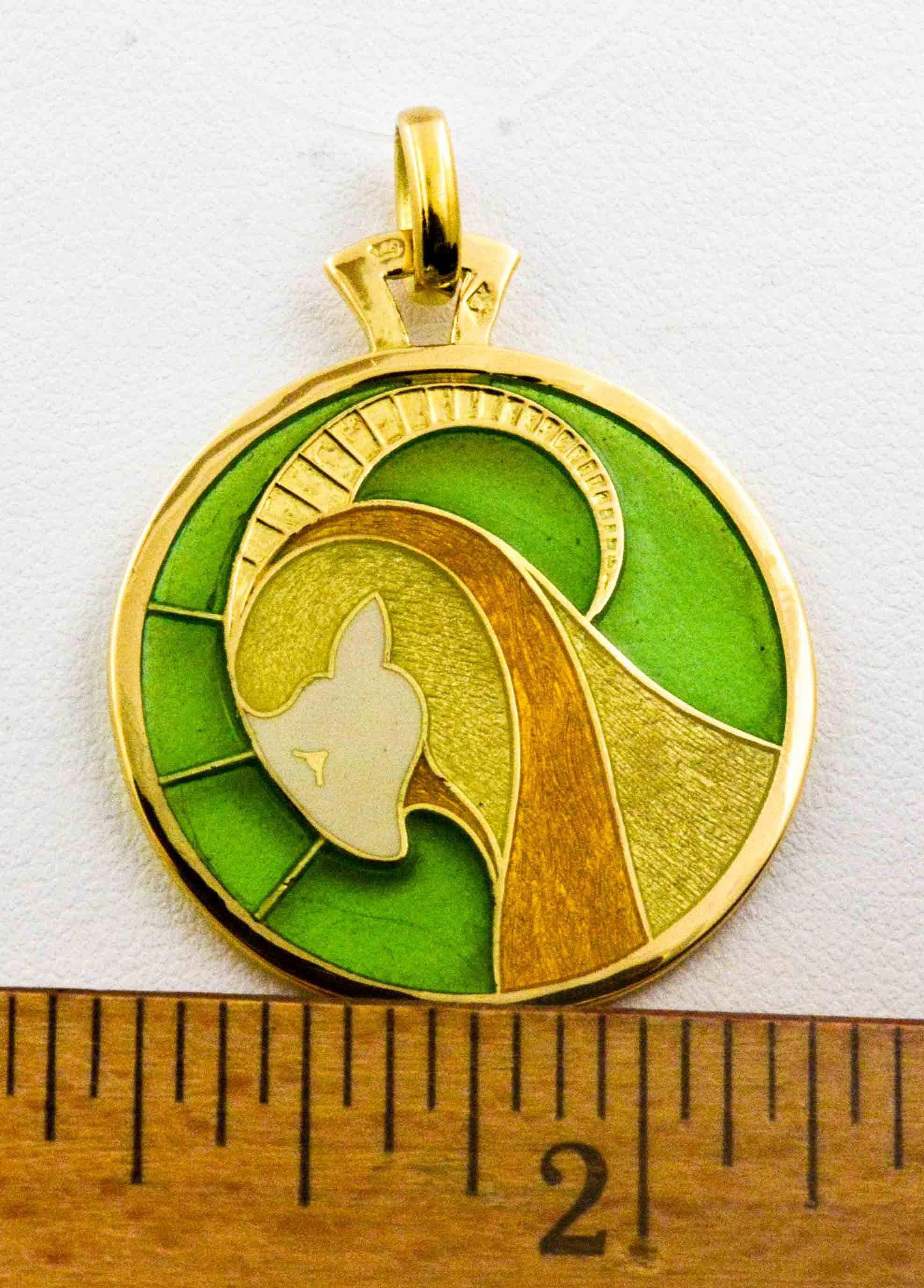 Plique a jour hand enameled glass Capricorn pendant. Light as a feather with intricate detailing in 18 karat yellow gold and handmade enameled glass showcasing a magnificent ram on a brilliant green background.