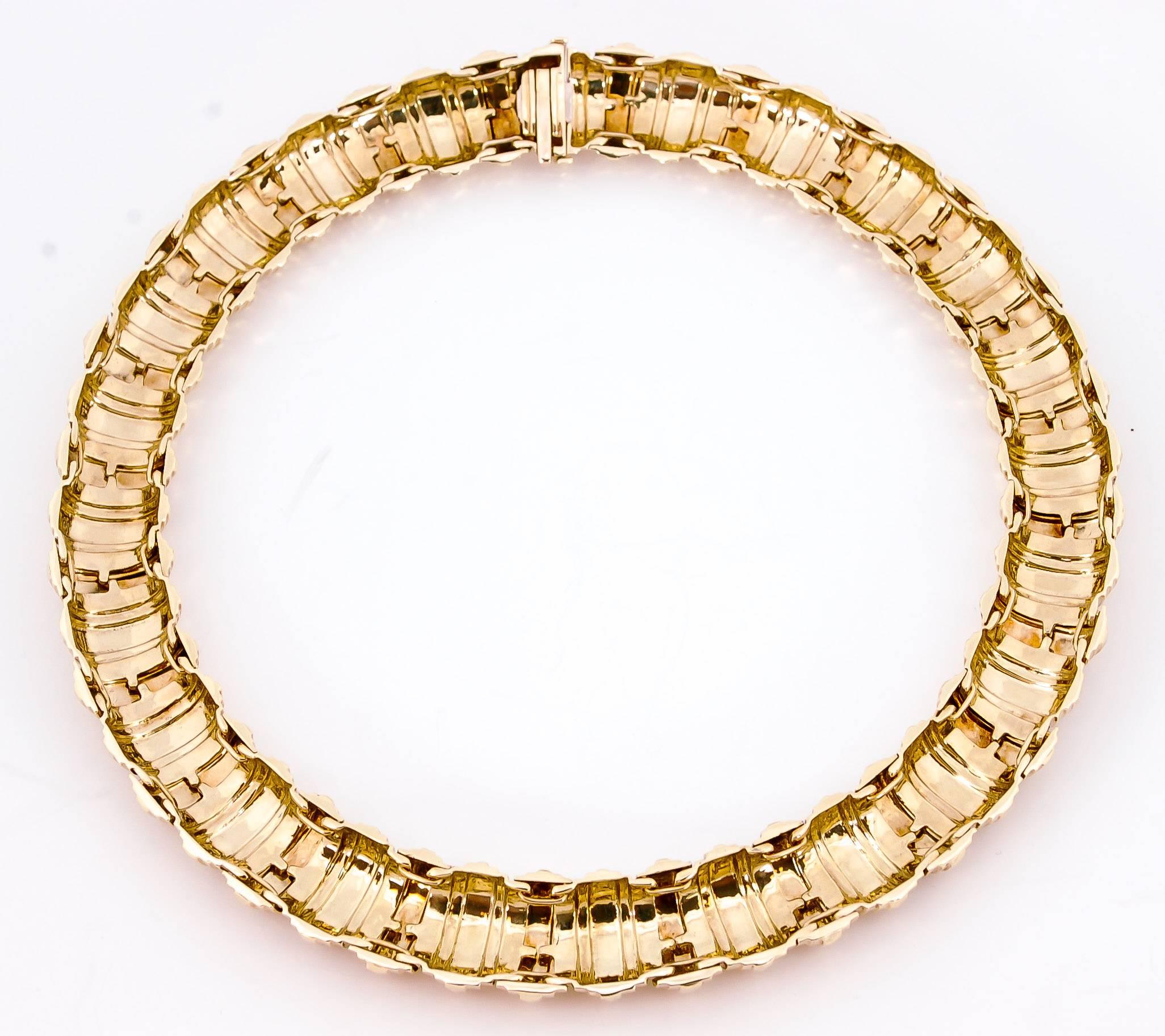 An incredible domed collar with an eye dazzling faceted surface that reflects light in14kt yellow.  This collar is a perfect stand alone piece as well as an great fixture for your favorite pendant. The collar weighs 134 grams and is 18 mm wide and