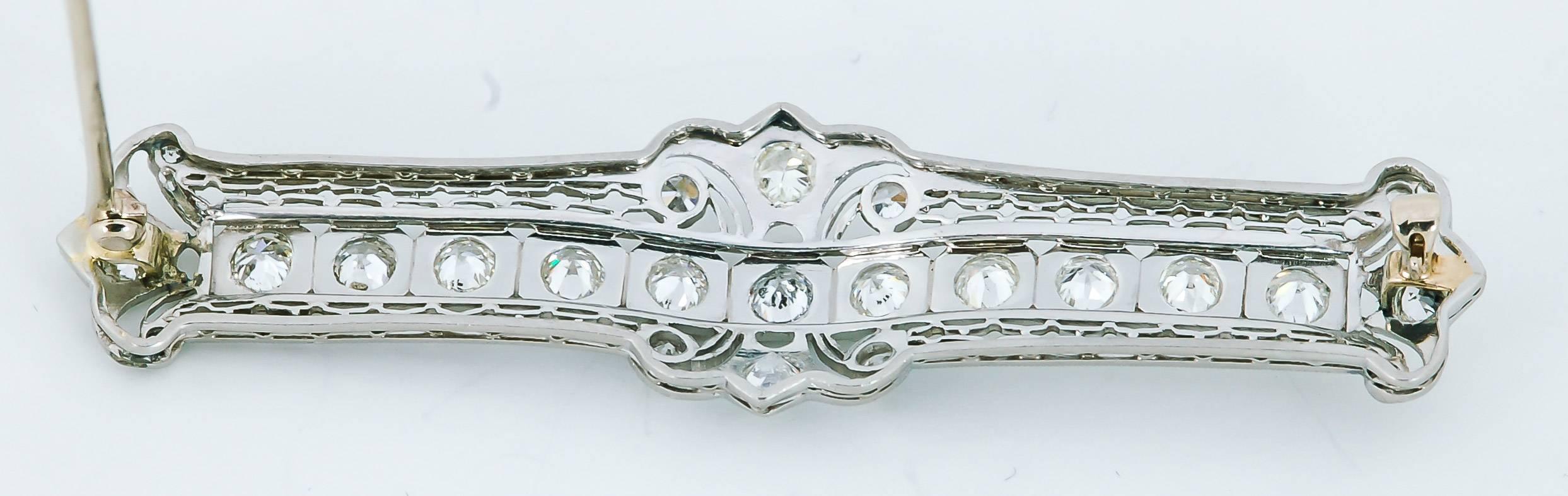 Eleven captivating Old European cut diamonds dance across this antique brooch. A delicate filigree design reminiscent of the Art Nouveau style is prominently displayed in this stunning brooch. It features Old European diamonds set in platinum with a
