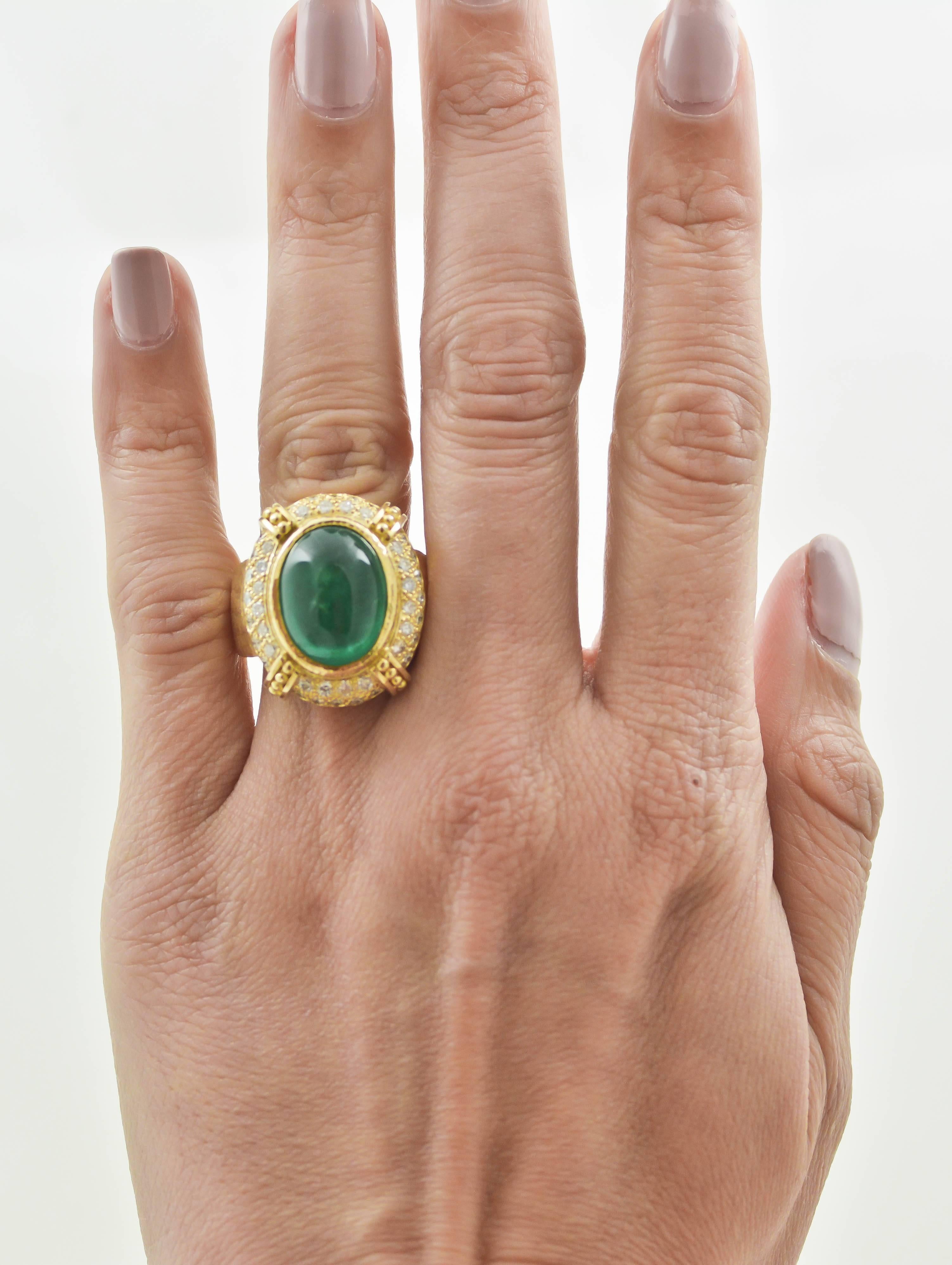 A cascade of textures surrounding the intense green emerald in this 18kt yellow gold ring, remind us of a gorgeous sunny day. The vibrant green color of a 12.59 carat, oval cabochon cut emerald makes this eye-catching ring a stunning, Tuscan style
