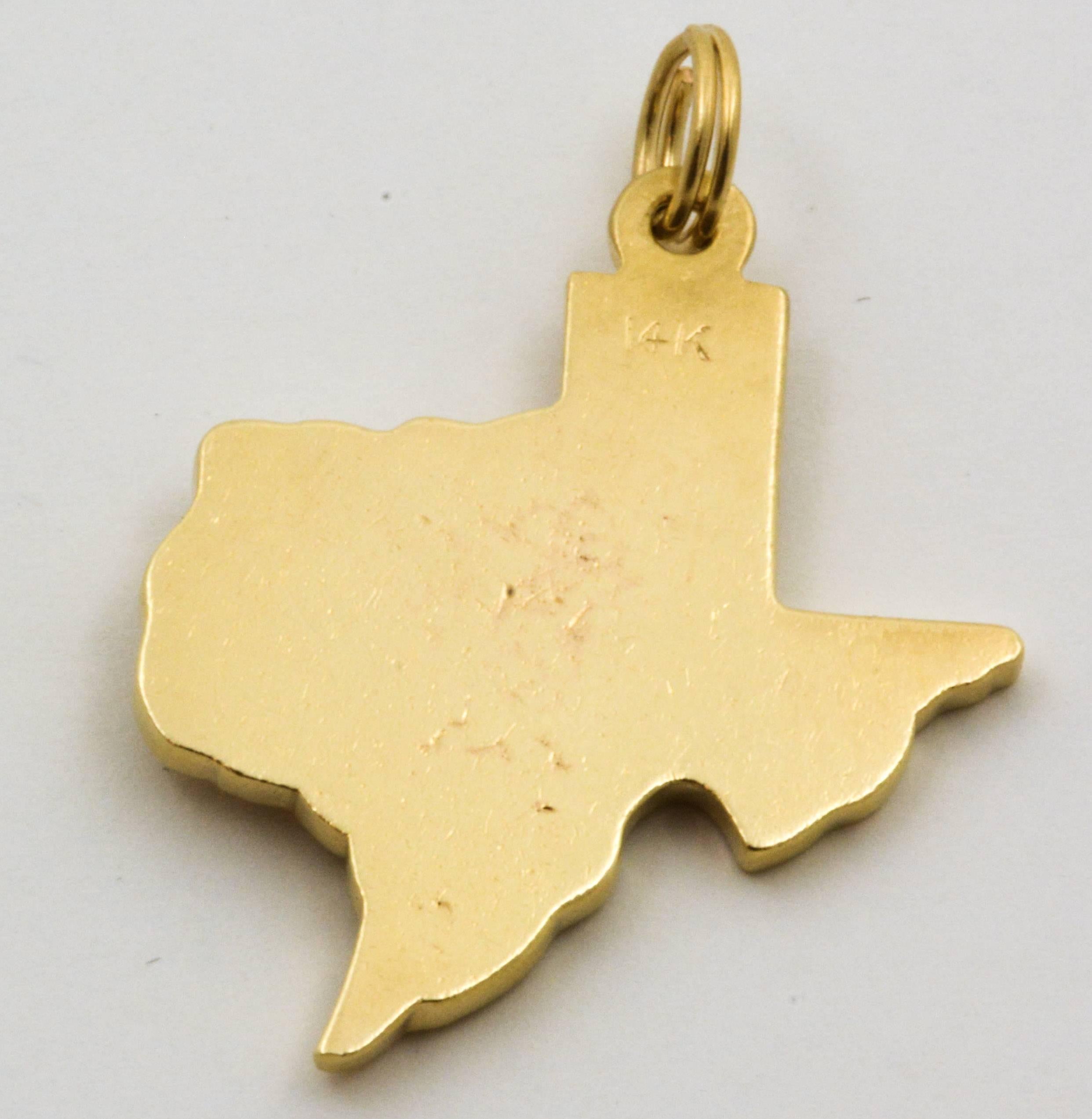 The unforgettable shape of the Lonestar State in beautiful 14kt yellow gold is embossed with the letters YPO and set with one round brilliant cut ruby at Houston’s location.