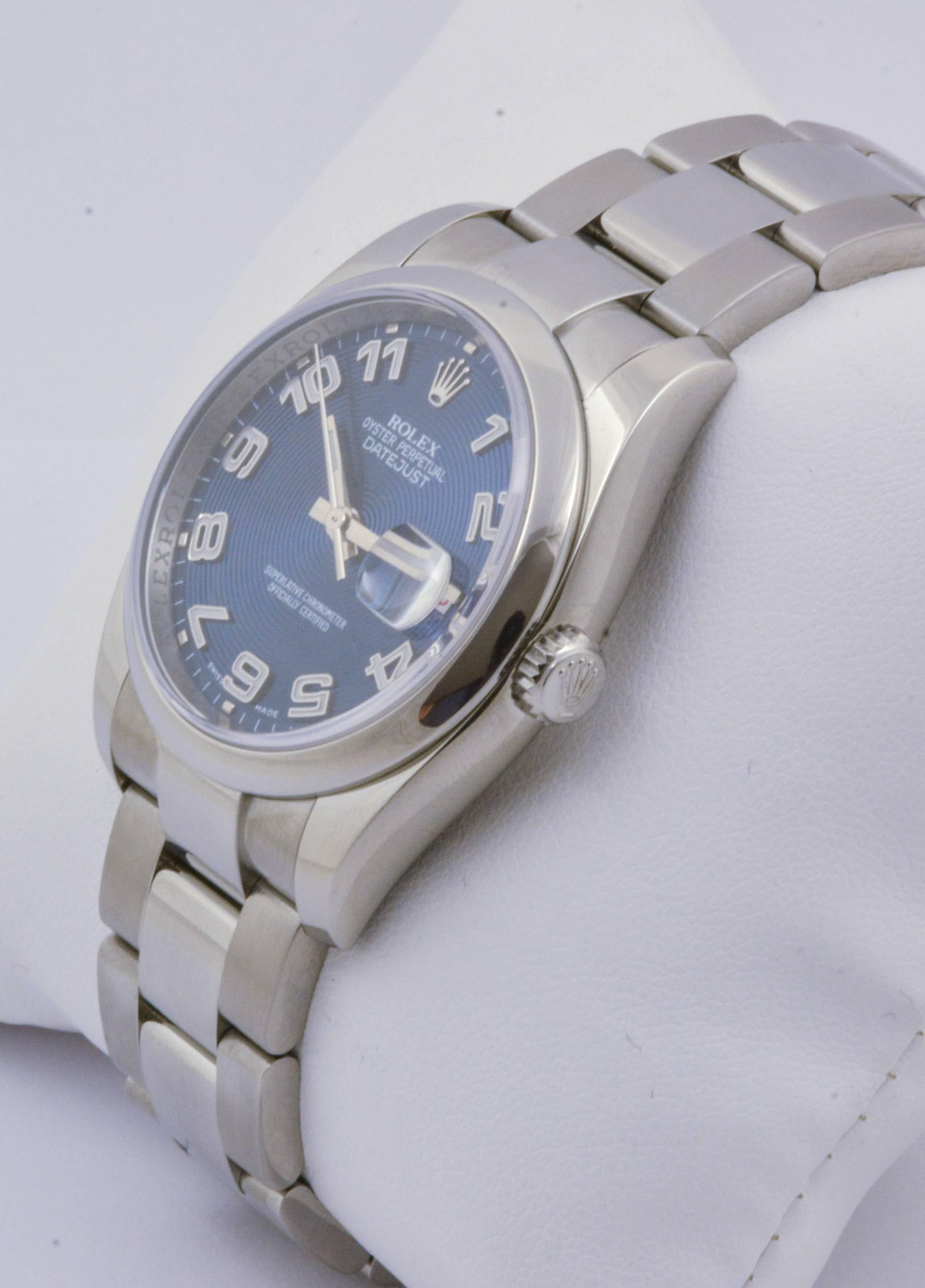 A stunning blue dial with Arabic numerals, sapphire crystal, and a smooth bezel render this 36mm pre-owned Rolex watch simultaneously timeless and hip. An Oyster style bracelet with fold over clasp fastens securely around the wrist in flawless