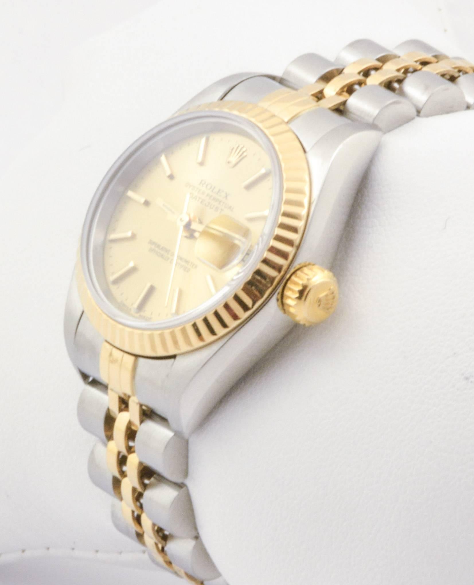 This striking certified pre-owned Rolex watch has a 26mm case with a fluted bezel and a classy champagne dial with dial markers. Fitted with a sapphire crystal, this timepiece has a Jubilee bracelet and is made with 18kt yellow gold and stainless