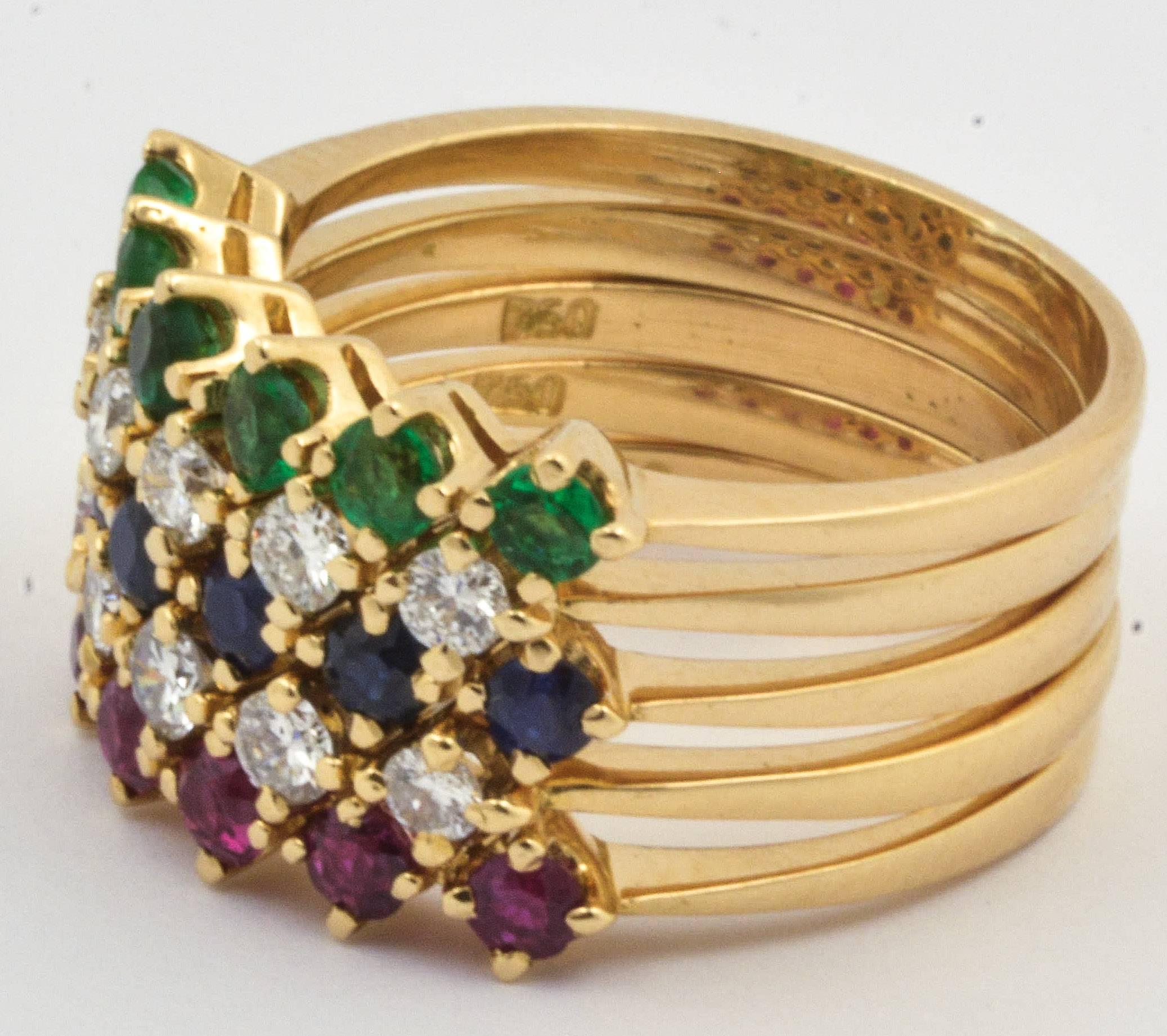 A fun 14kt yellow gold, diamond sapphire and ruby stackable set of five rings.  These rings are set with ten round brilliant cut diamonds that have a total approximate weight of 0.50 carats, internal clarity of SI2 and color of H.  The rings are
